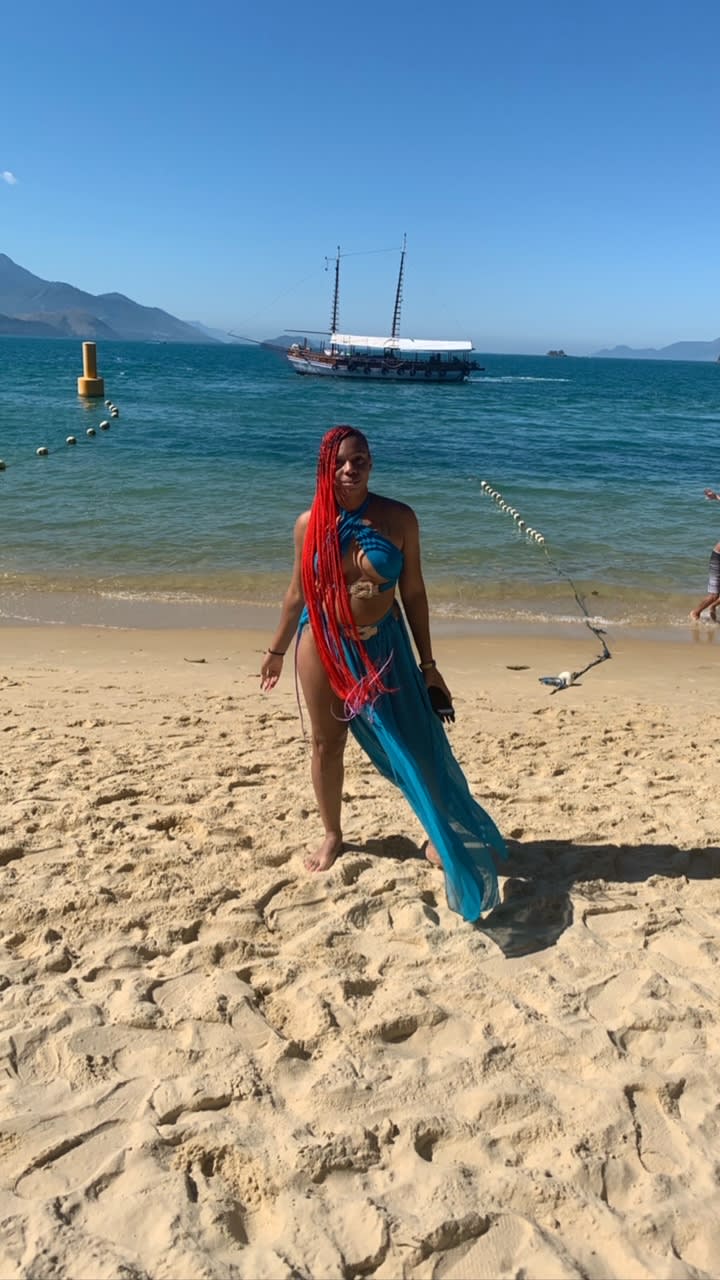 Picture of Danielle on beach in sand
