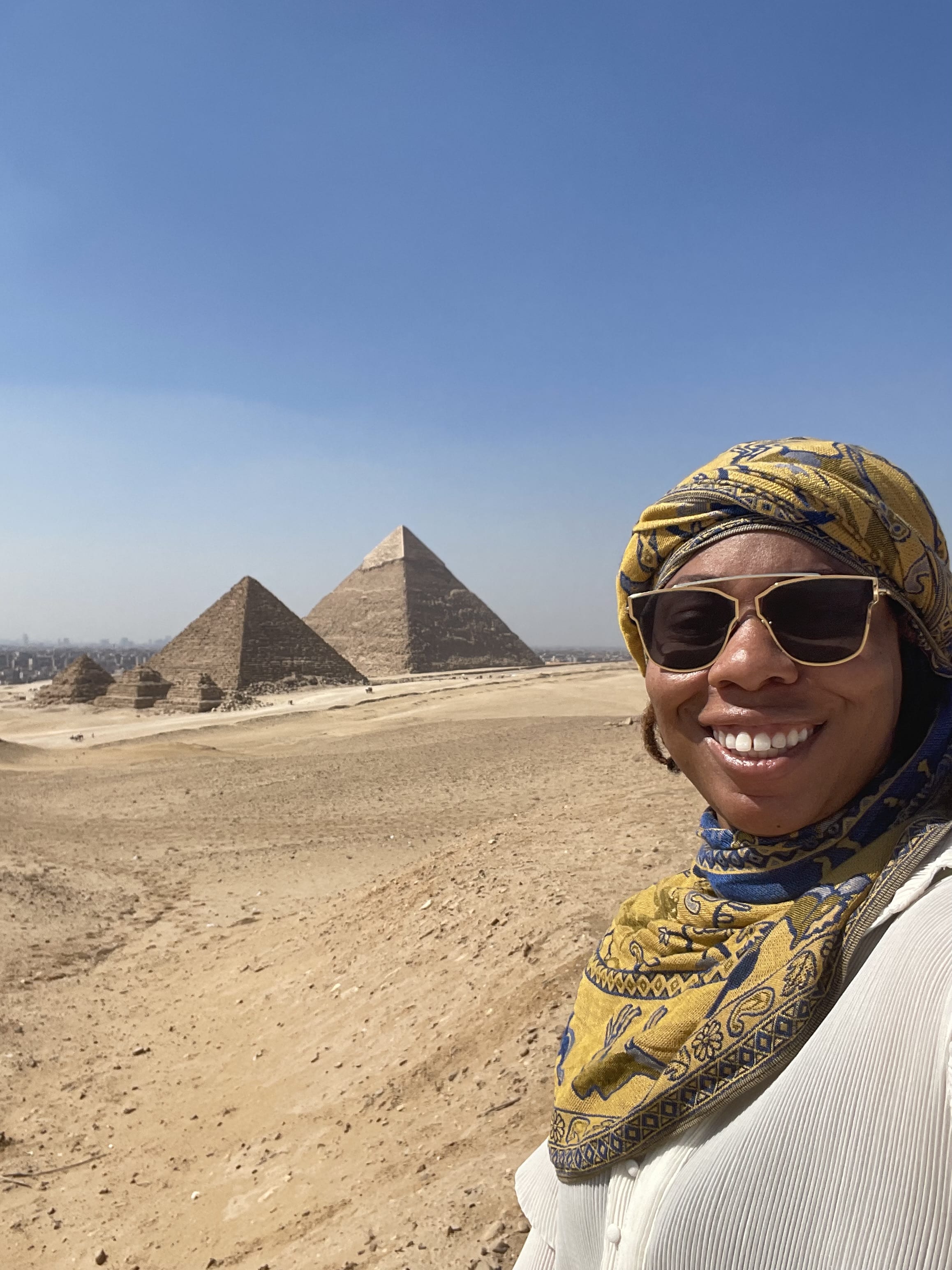 Picture of Danielle with pyramids in view