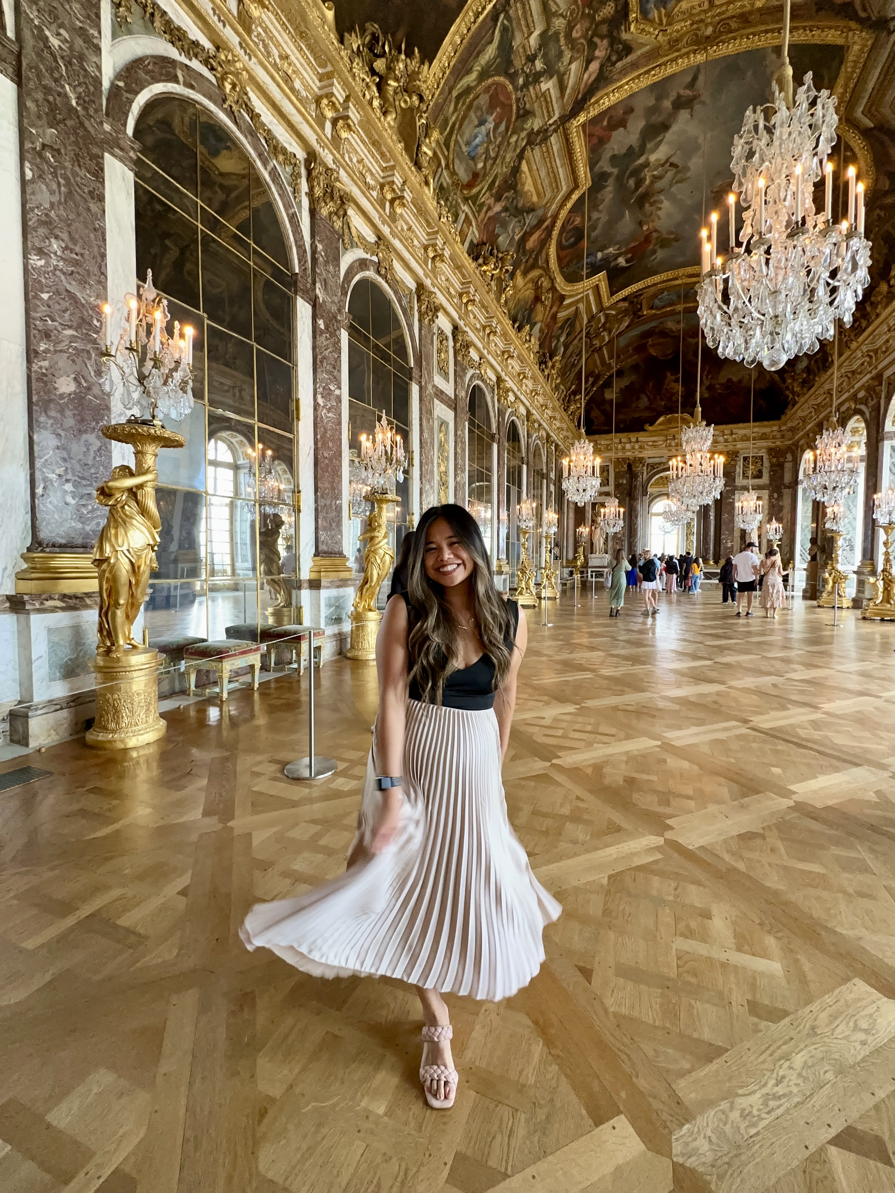Posing for a photo in the Hall of Mirrors