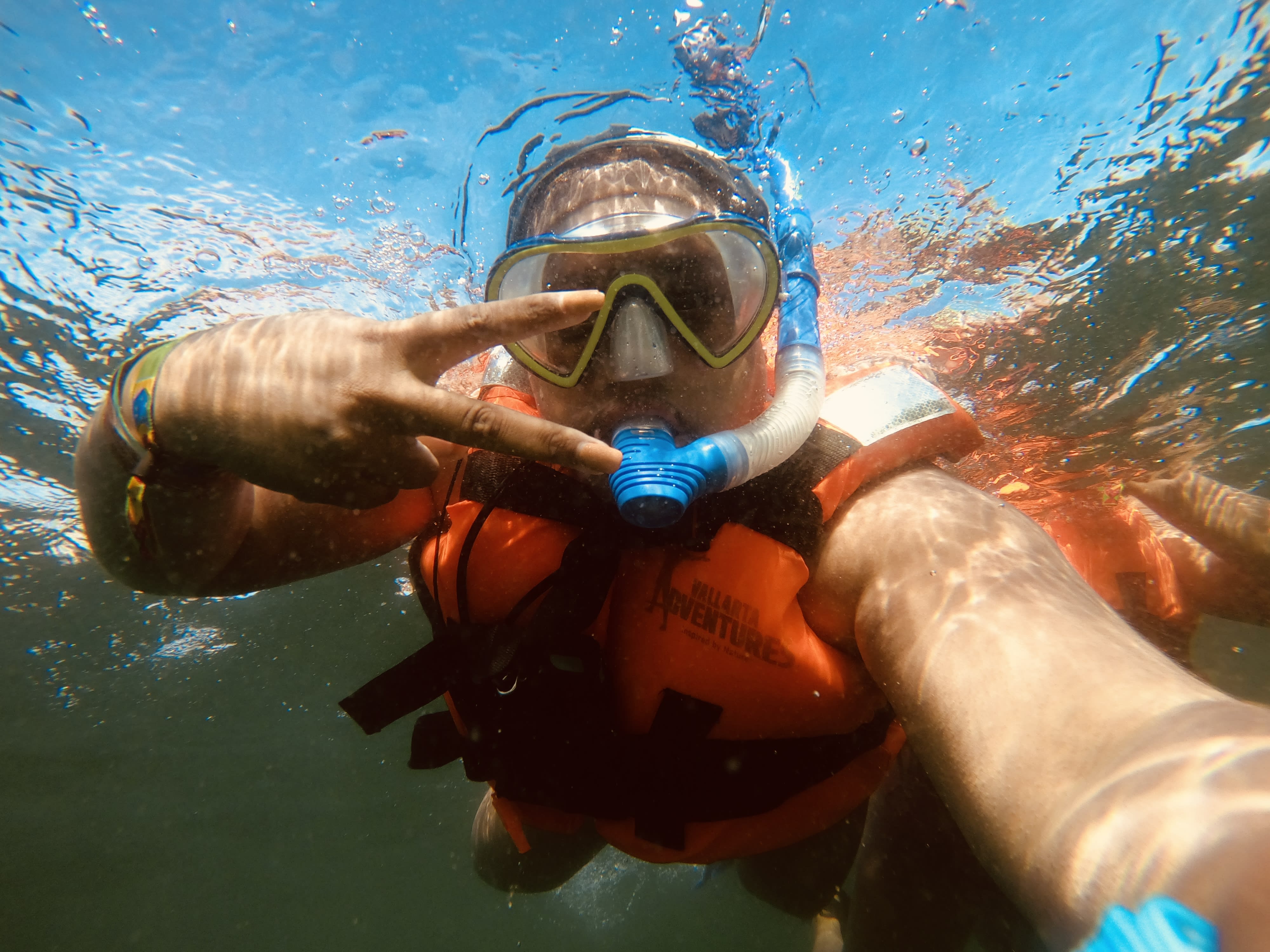 Travel advisor Antonisia taking an underwater selfie while snorkeling