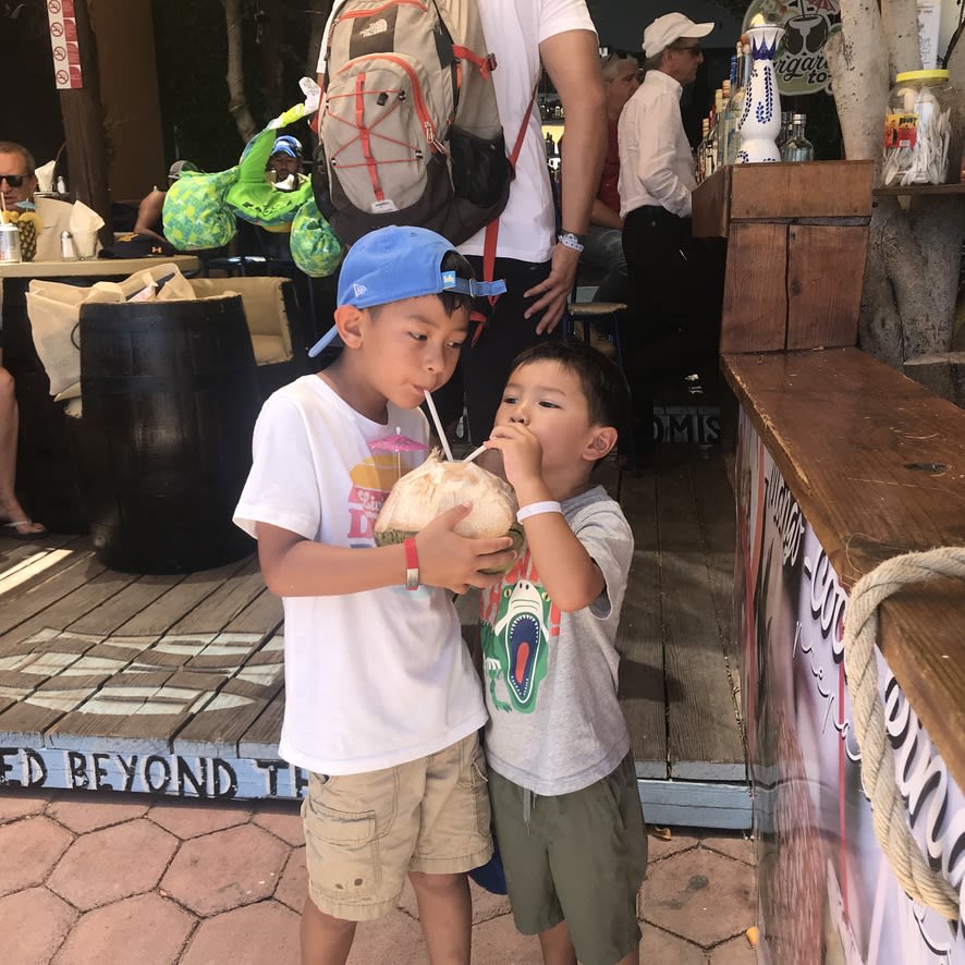 Kids drinking coconut water
