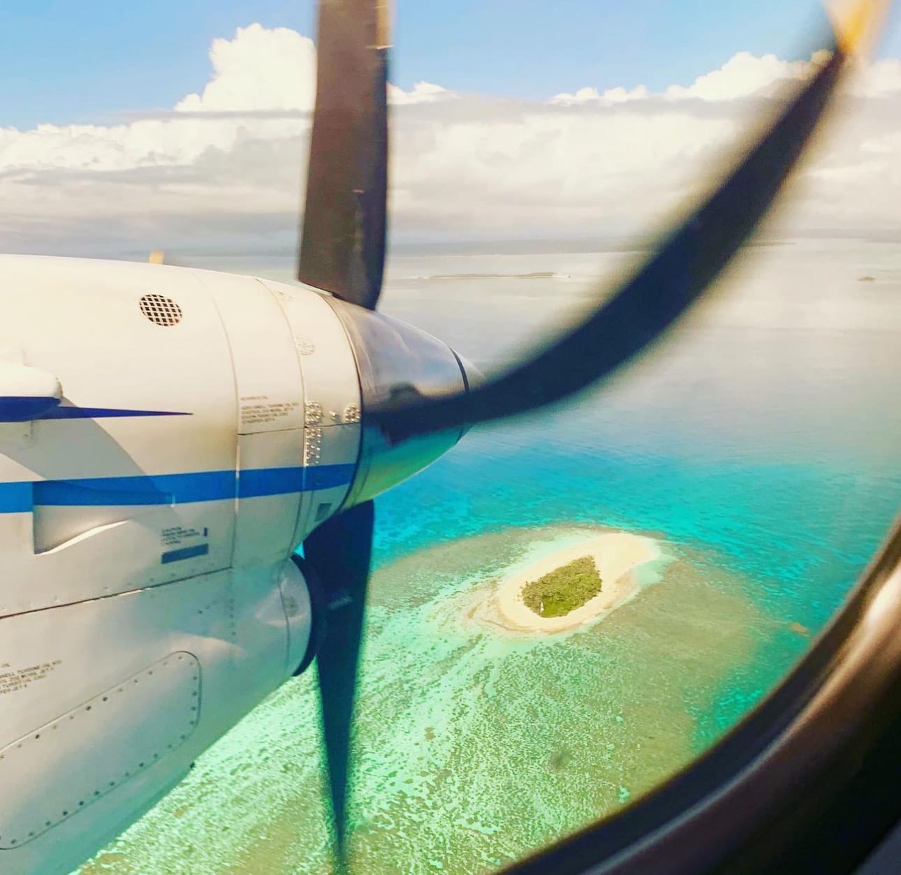 View out of an airplane at the water below.