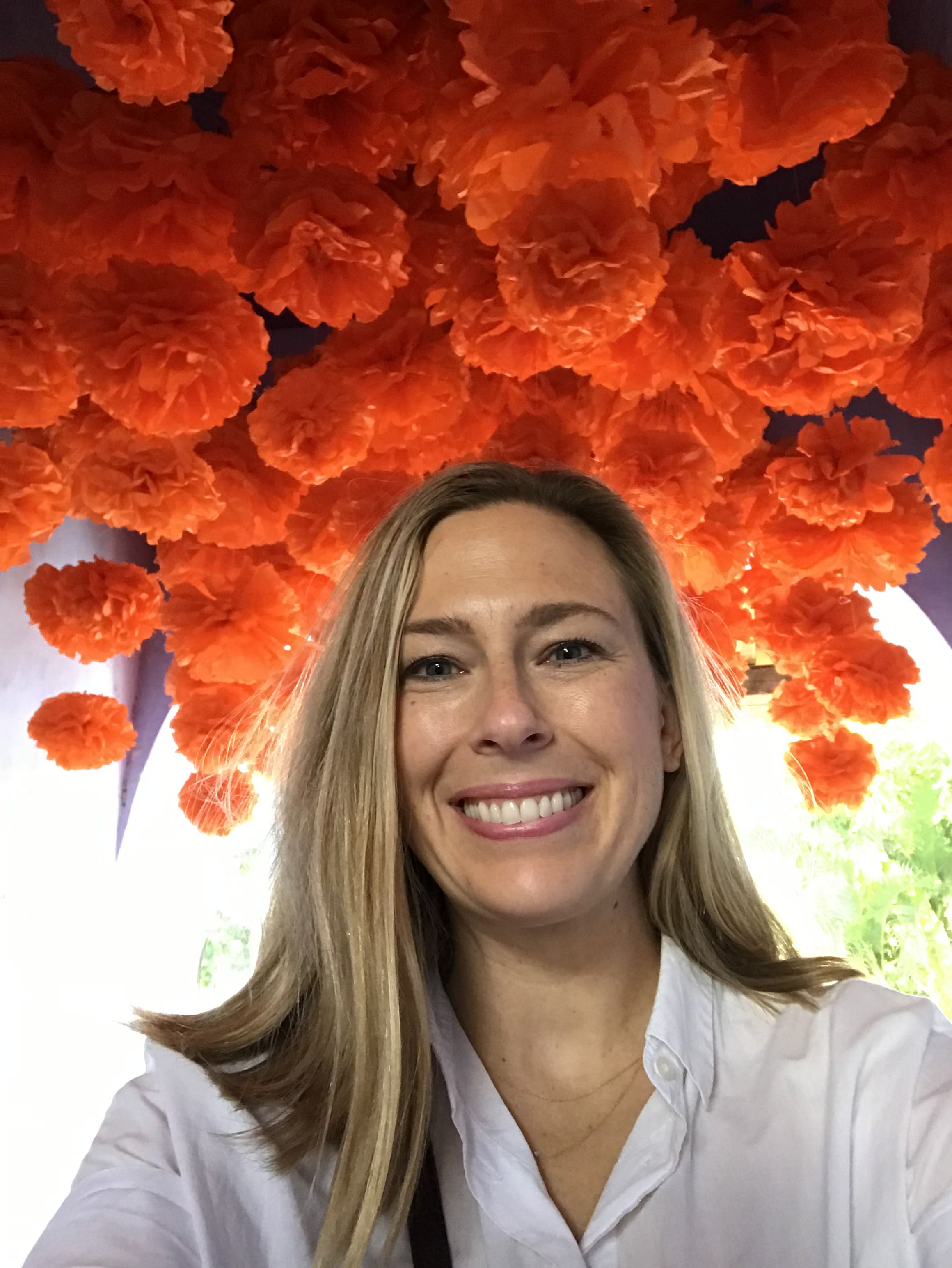 Posing for a selfie with flower decoration in view