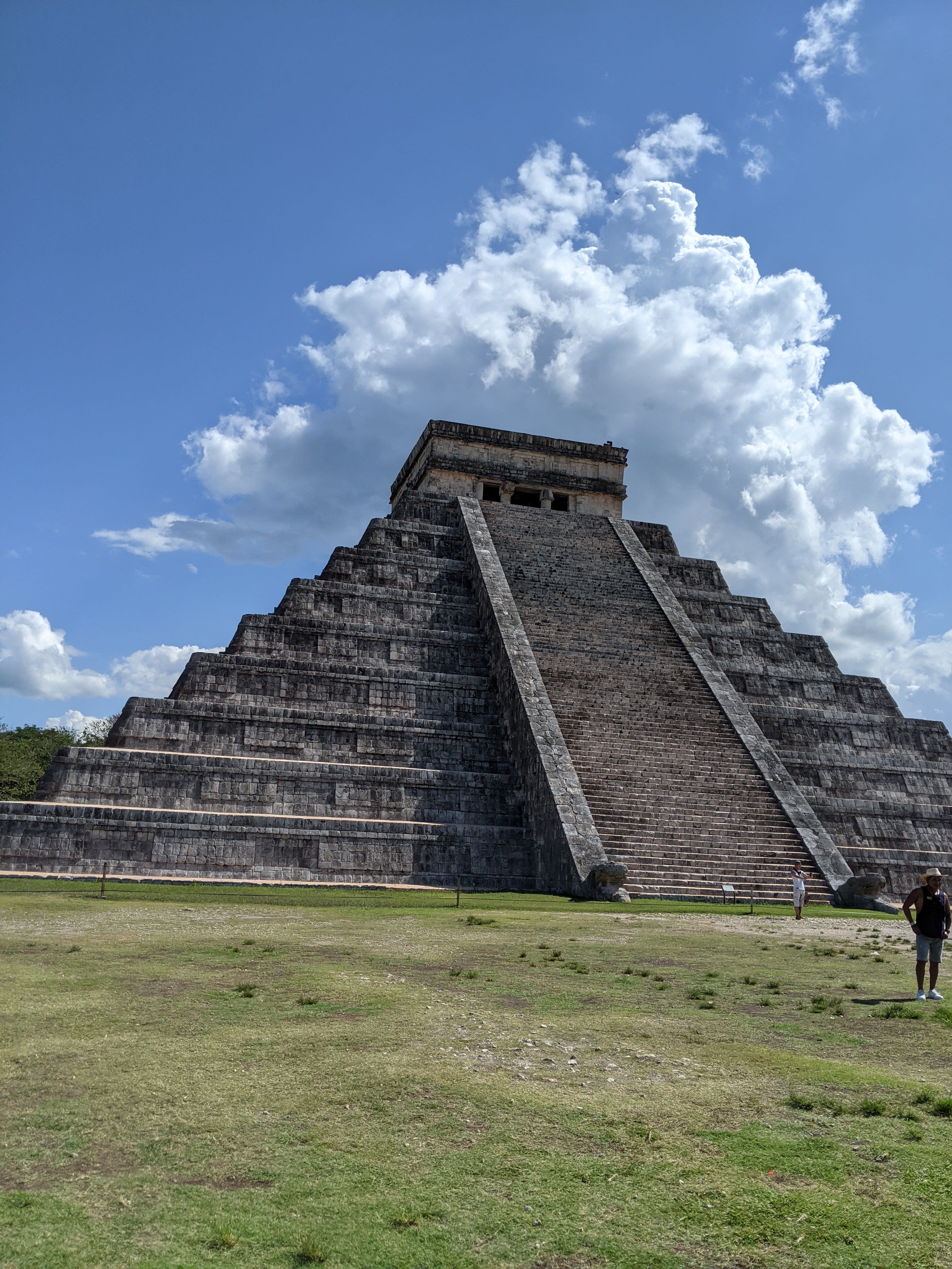 Beautiful view from the bottom of El Castillo, a large ancient pyramid, on a sunny day