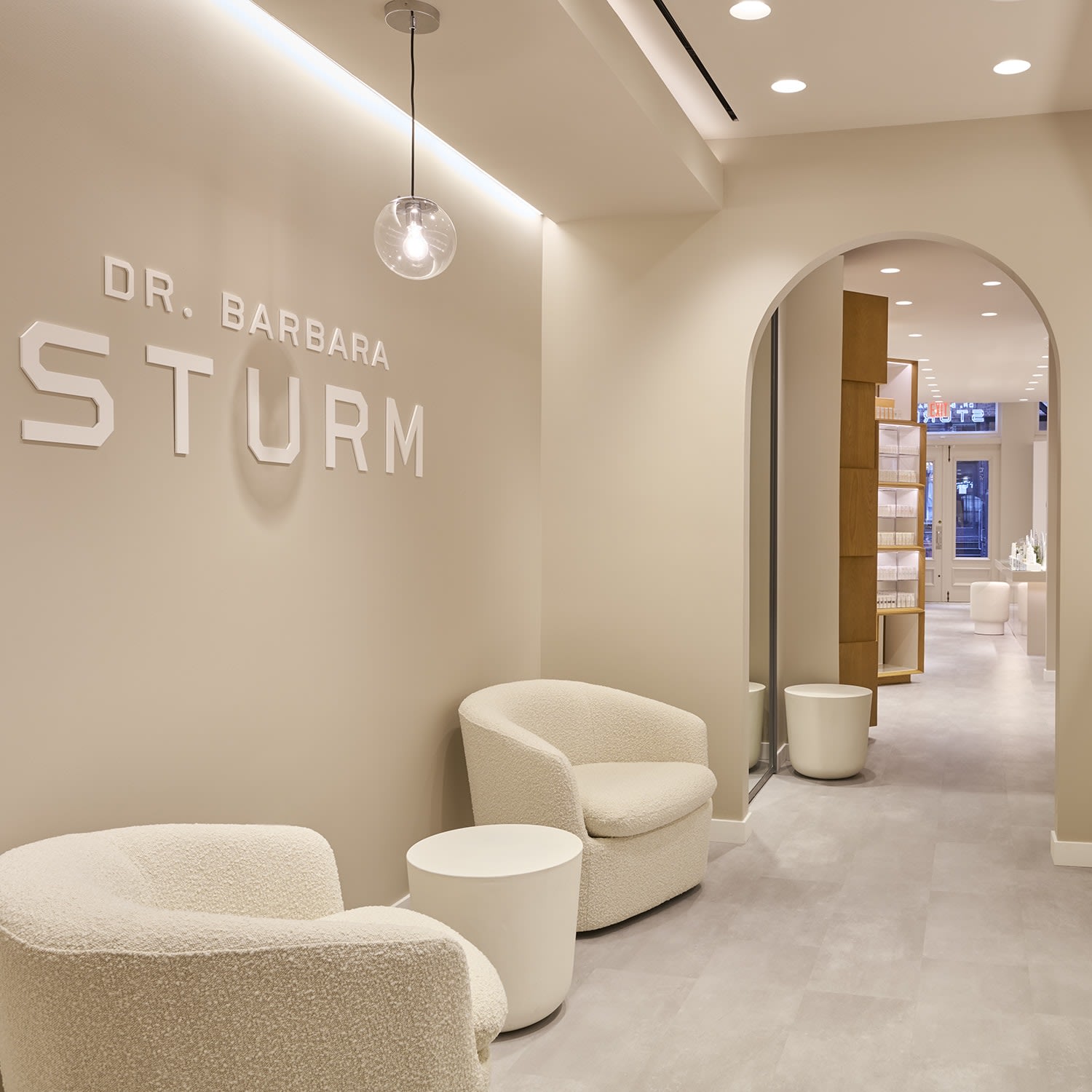 Image a brick hotel exterior with a clock on a downtown city street