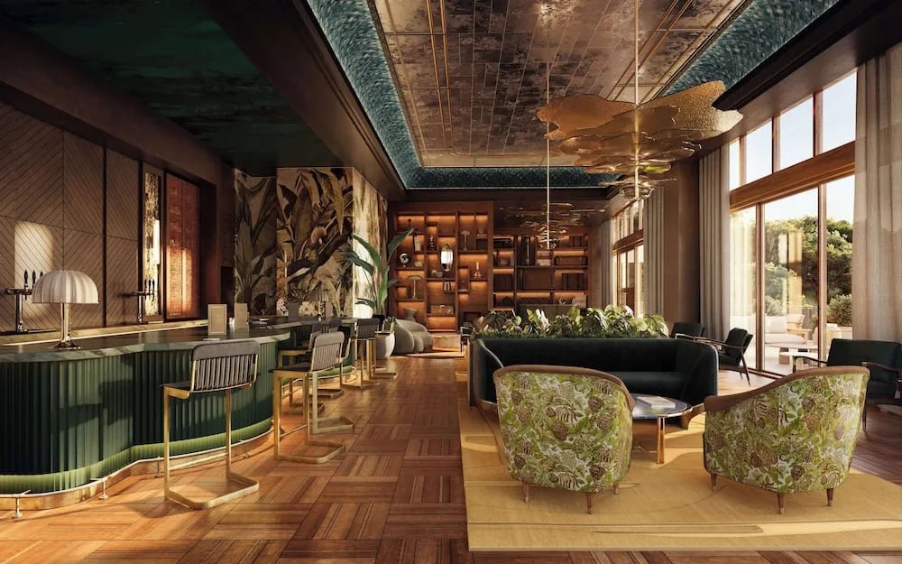 a swanky restaurant dining room with wooden floors and green furniture