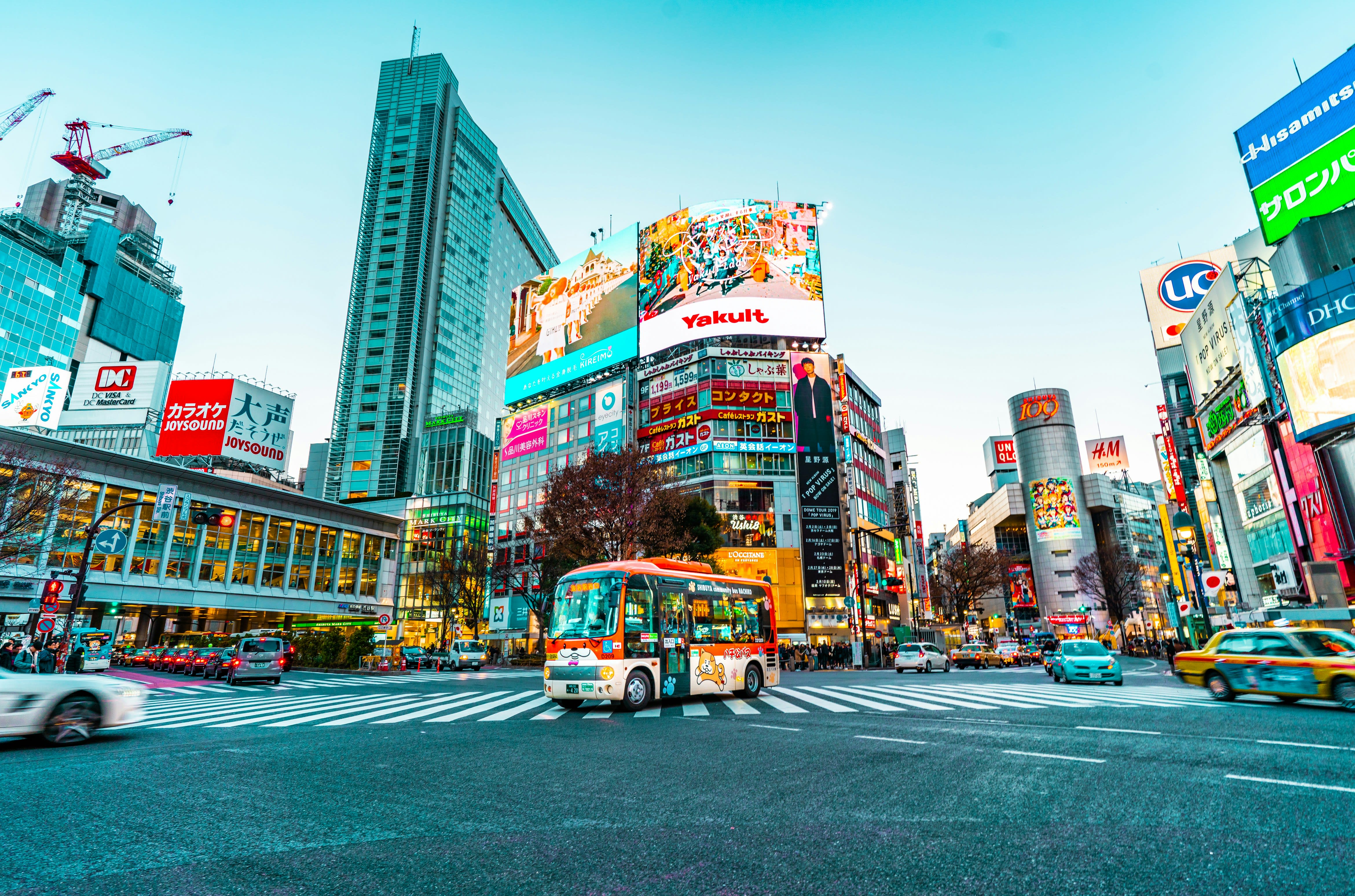 A colorful view of Tolyo streets with neon billboards