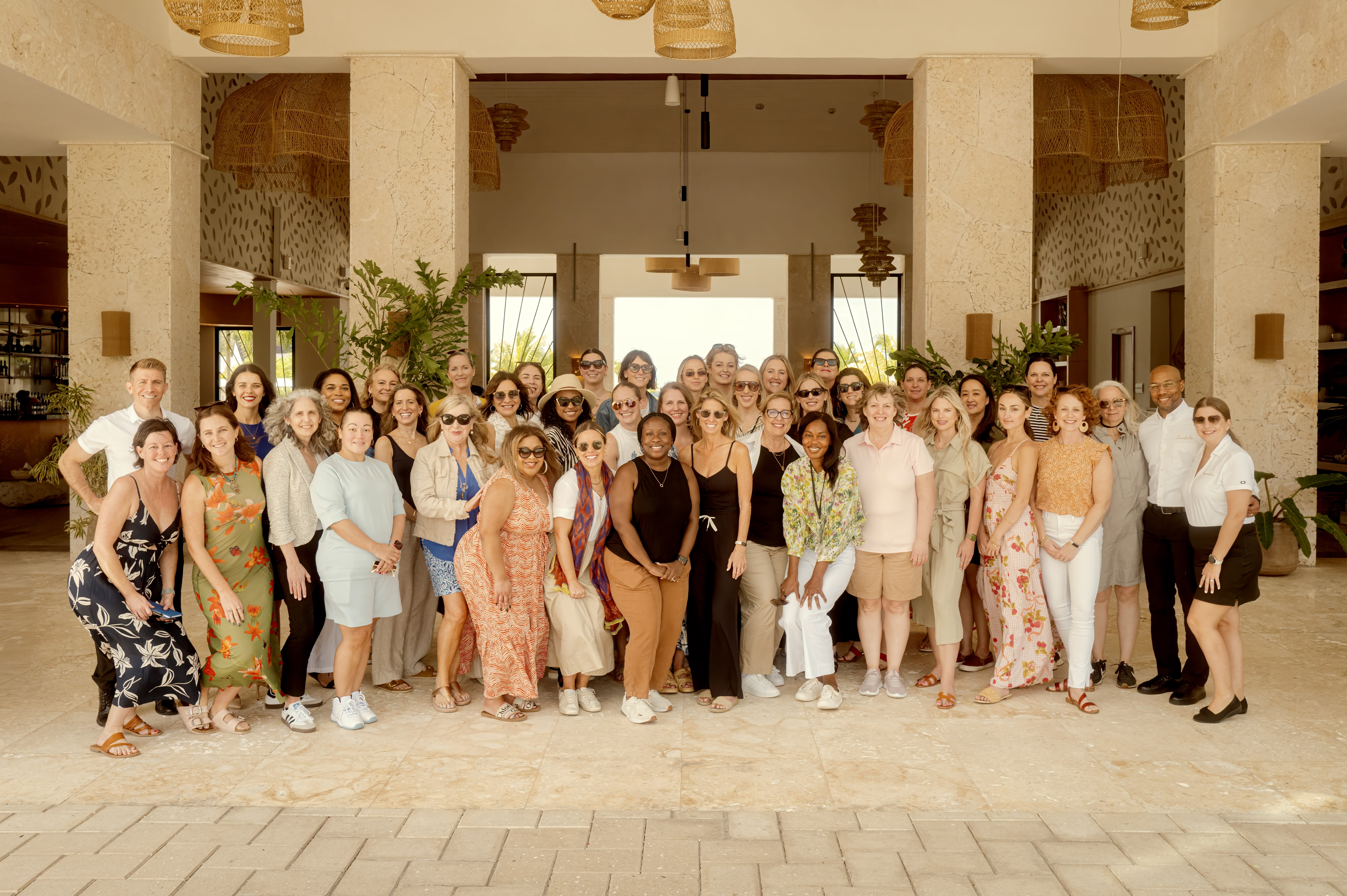 group of people posing on a terrace