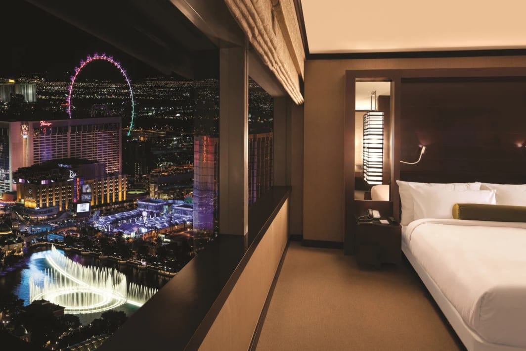 Hotel room with night view of Las Vegas strip