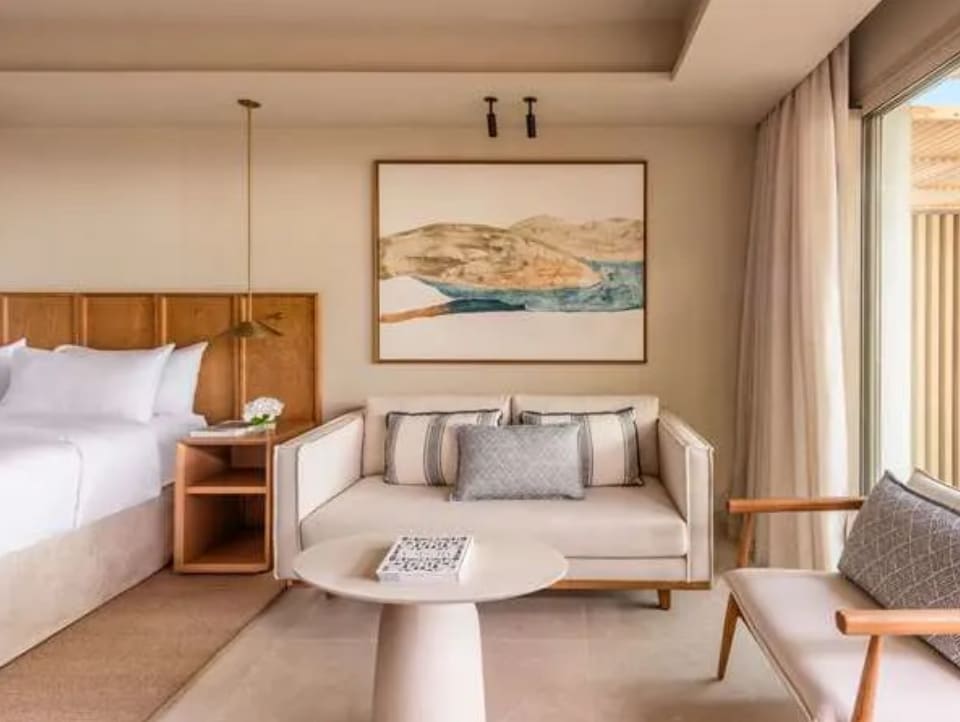 Bright and modern hotel room with cream and neutral tones