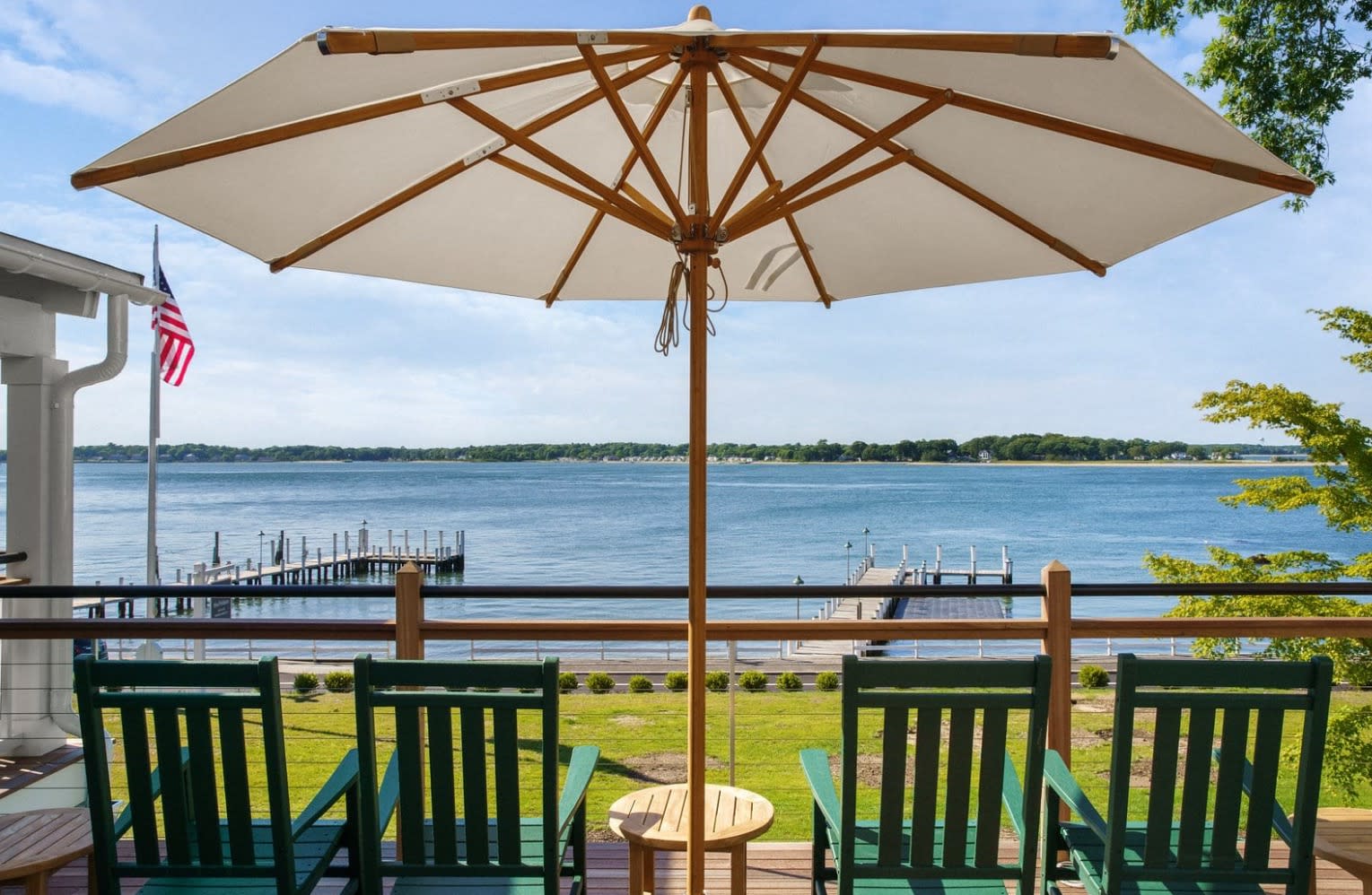 view from a porch overlooking a dock and water