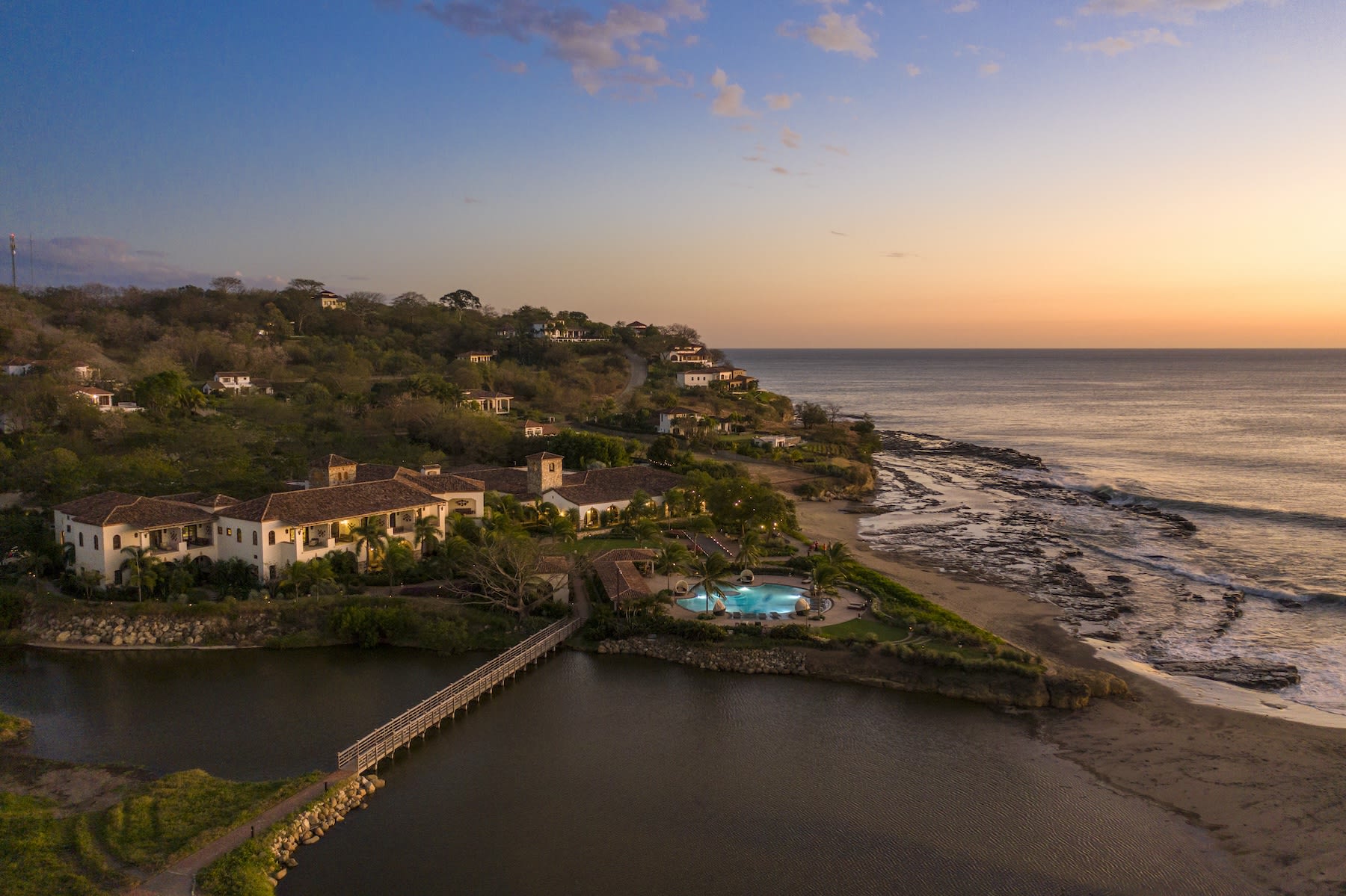 aerial view of a beachfront lagoon at dusk