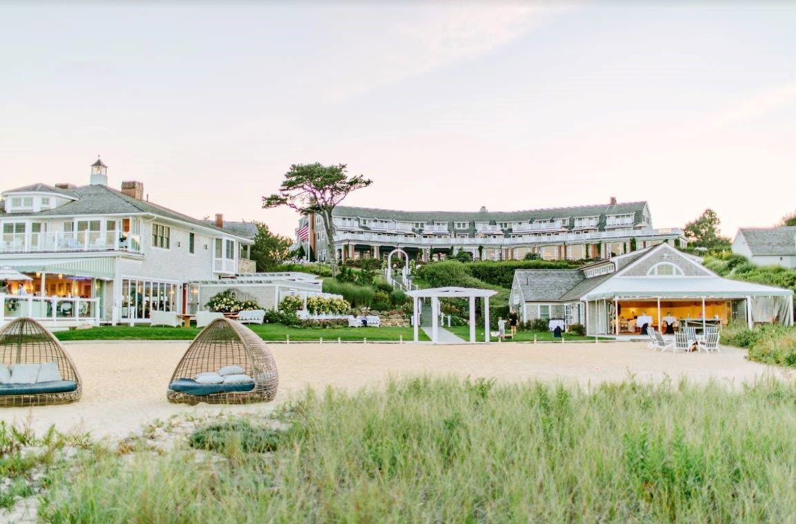A coastal beach resort with green grass in late afternoon