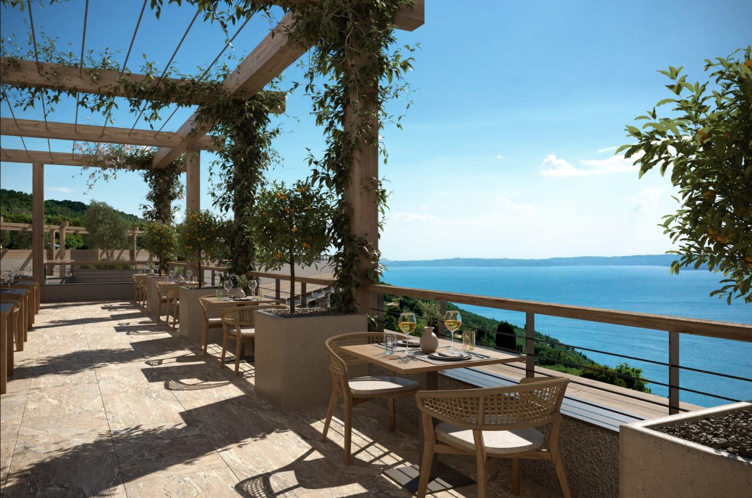 outdoor terrace with greenery, furniture and a view of the water