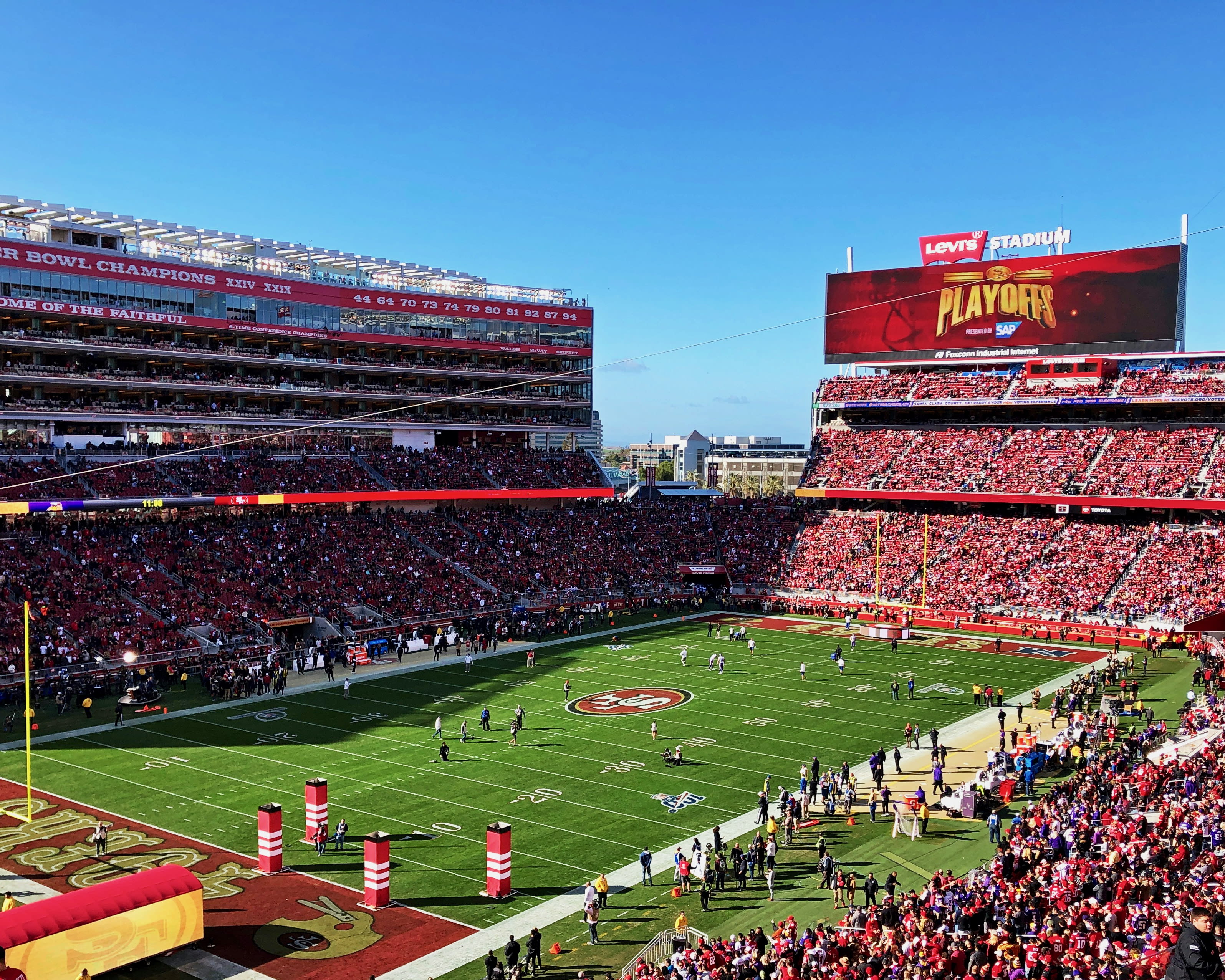 a packed football stadium during day