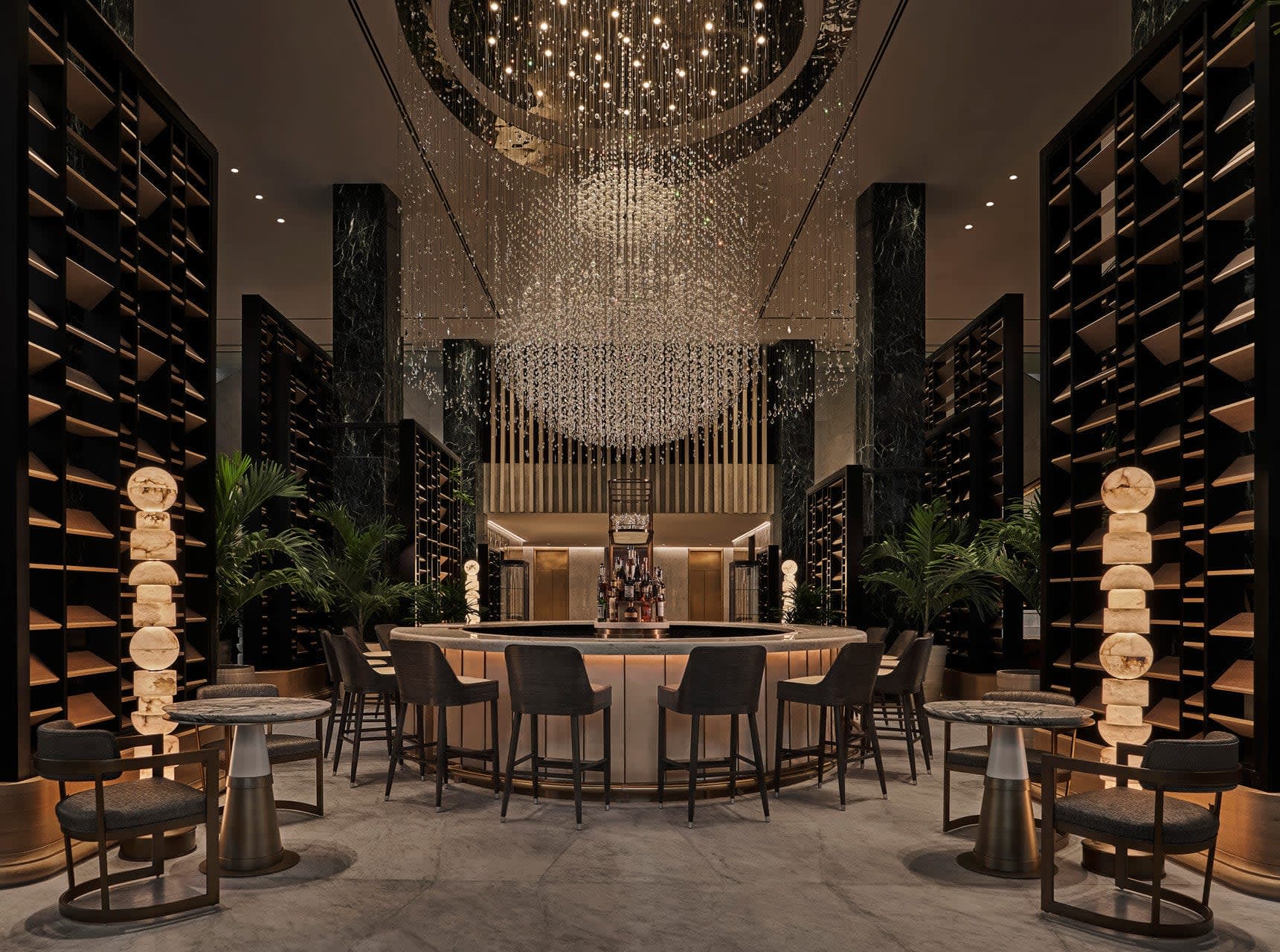 chandelier lobby bar with dark slat walls, and tall ceiling