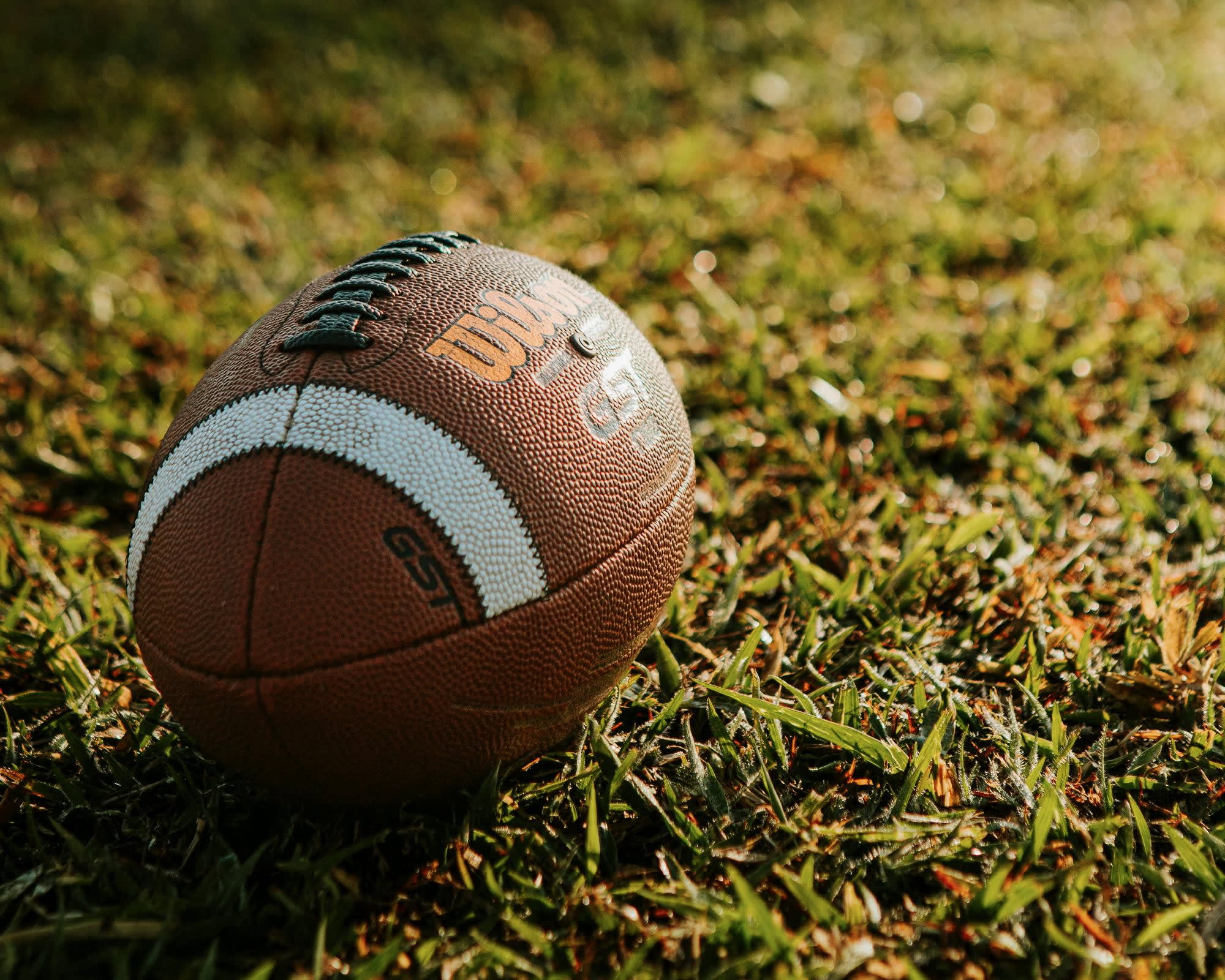football on grass during day
