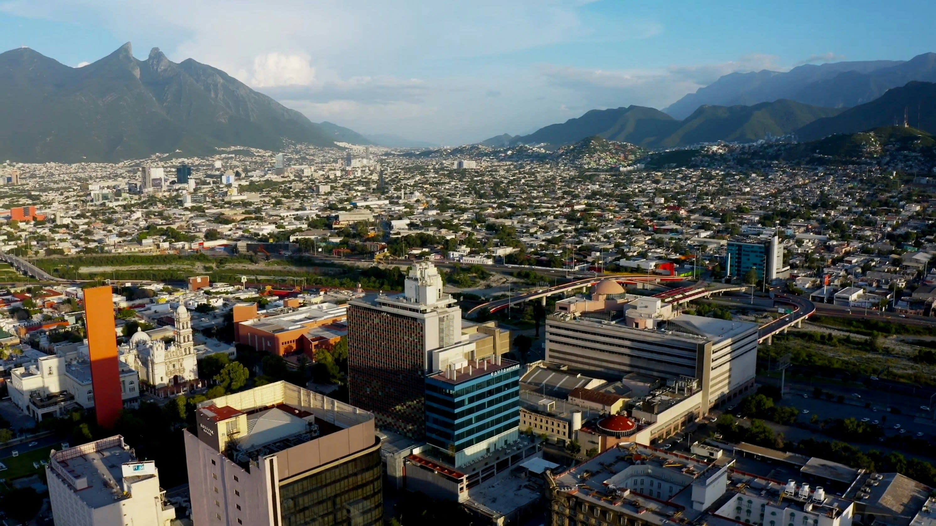 aerial view of a city with a mountain beyond