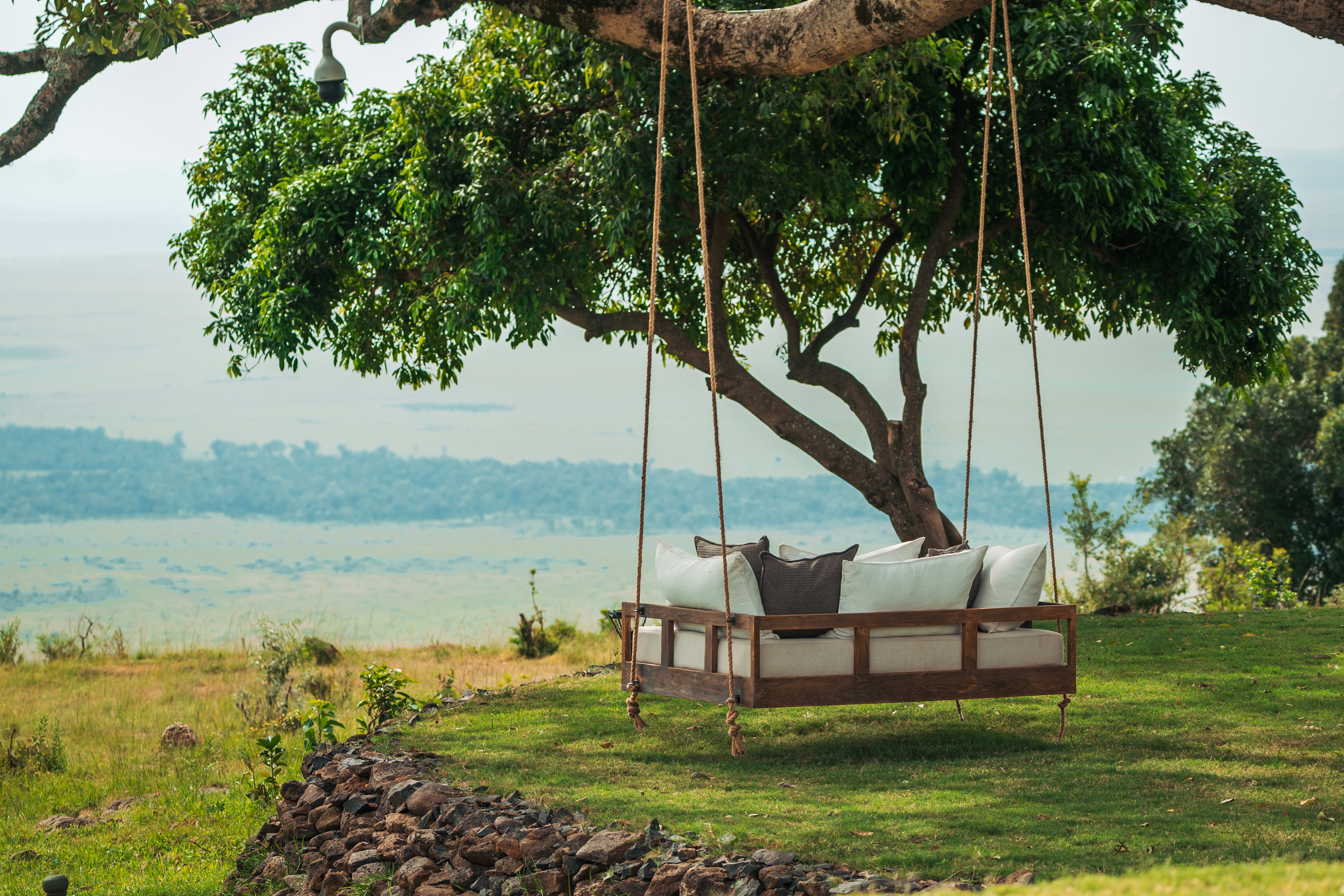 cushioned swing overlooking a sweeping landscape
