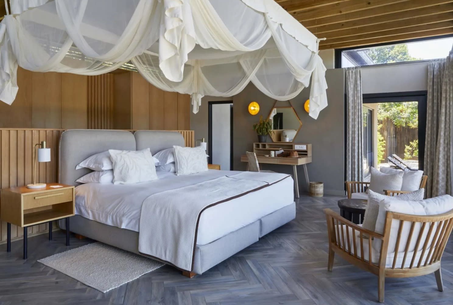 bedroom with large bed with mosquito netting