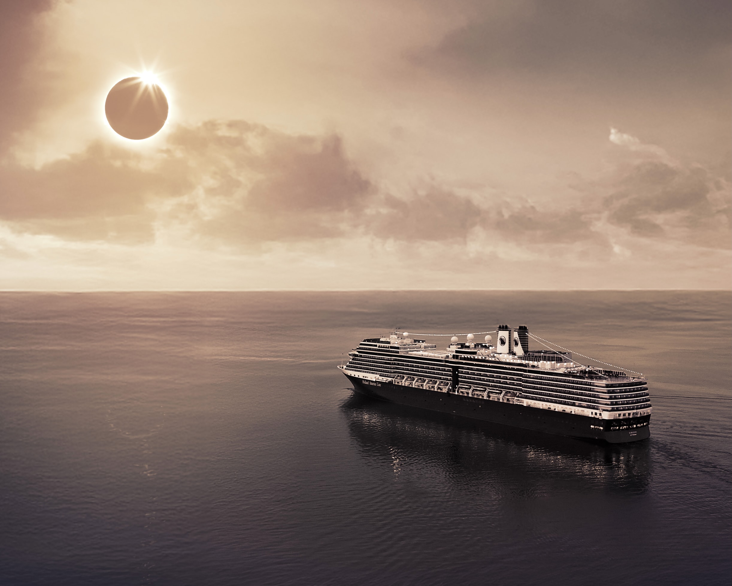 A cruise ship at sea with a total solar eclipse in the sky during day