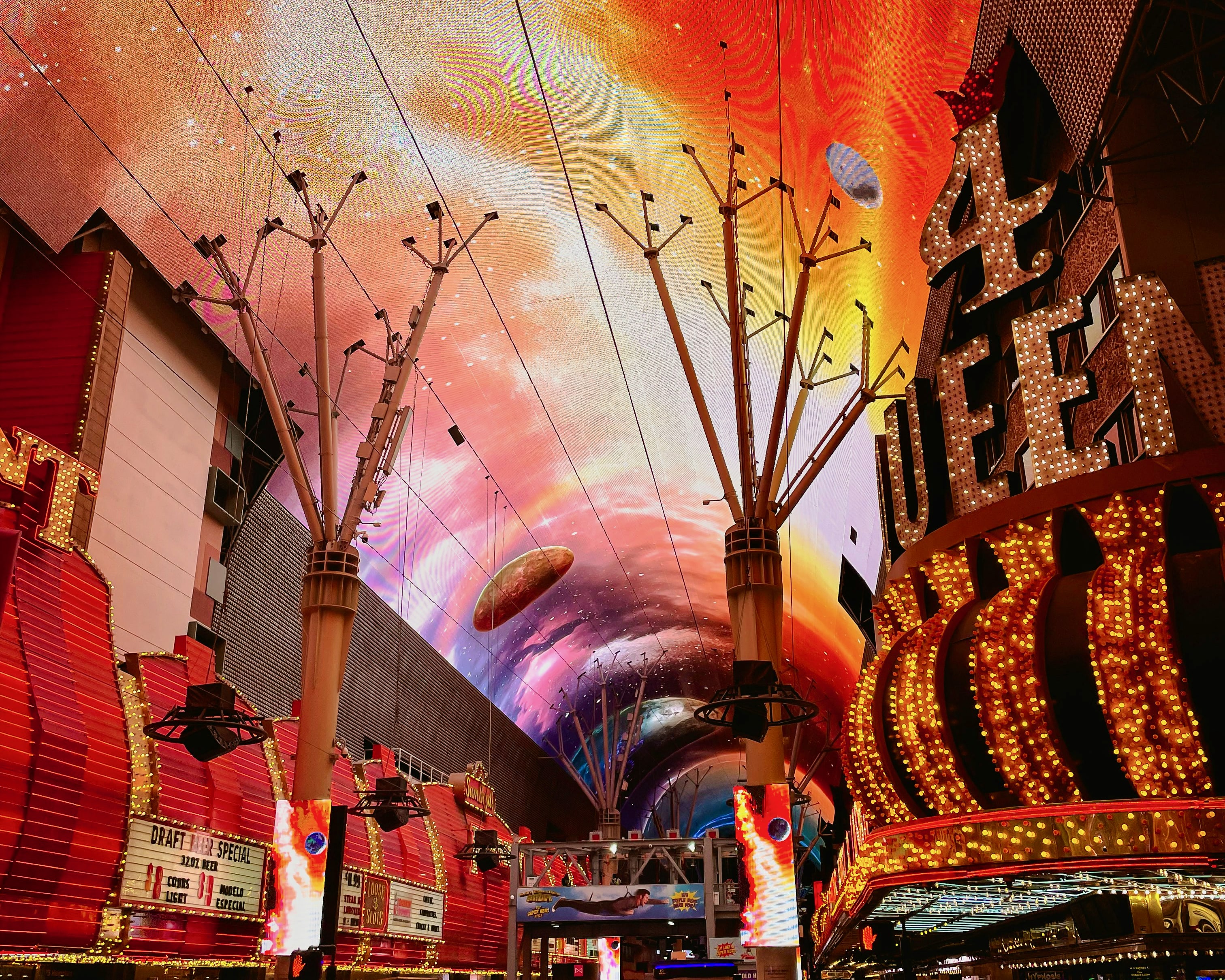 illuminated multistory ceiling with casino signs