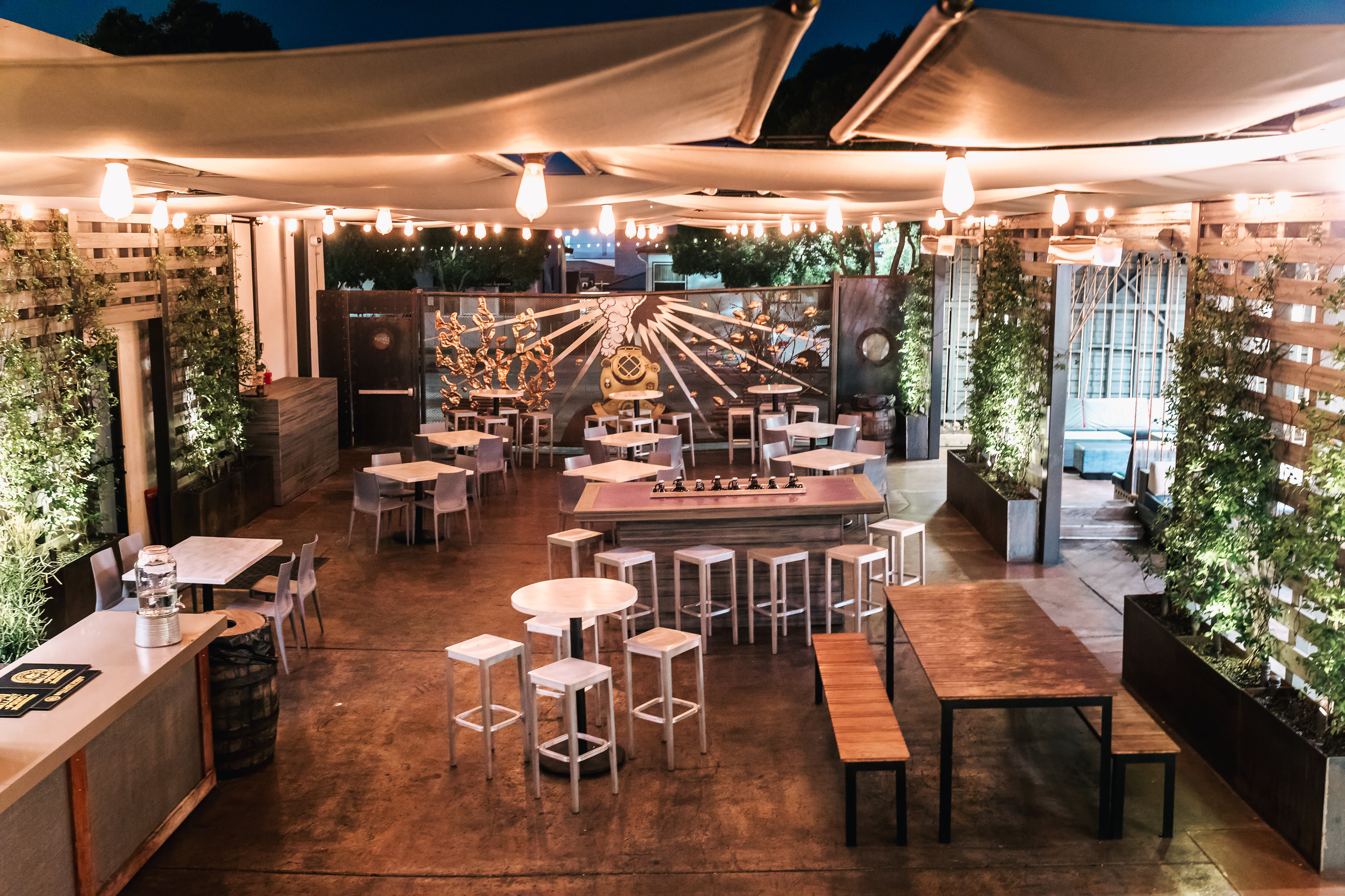 Evenings in Little Italy—a warm, open-air setting where modern design meets neighborhood charm, perfect for gathering, dining, and lingering long after sunset.
