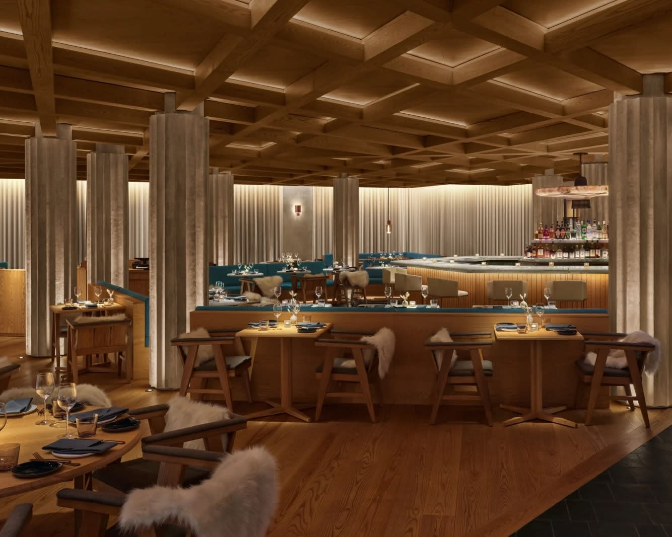 a restaurant with brown wood, tan stone columns and blue fabric accents