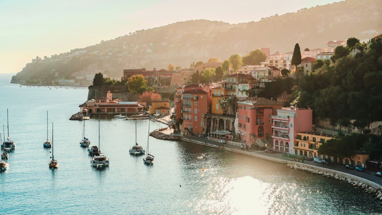 Villefranche-sur-Mer with boats and buildings on the coastline
