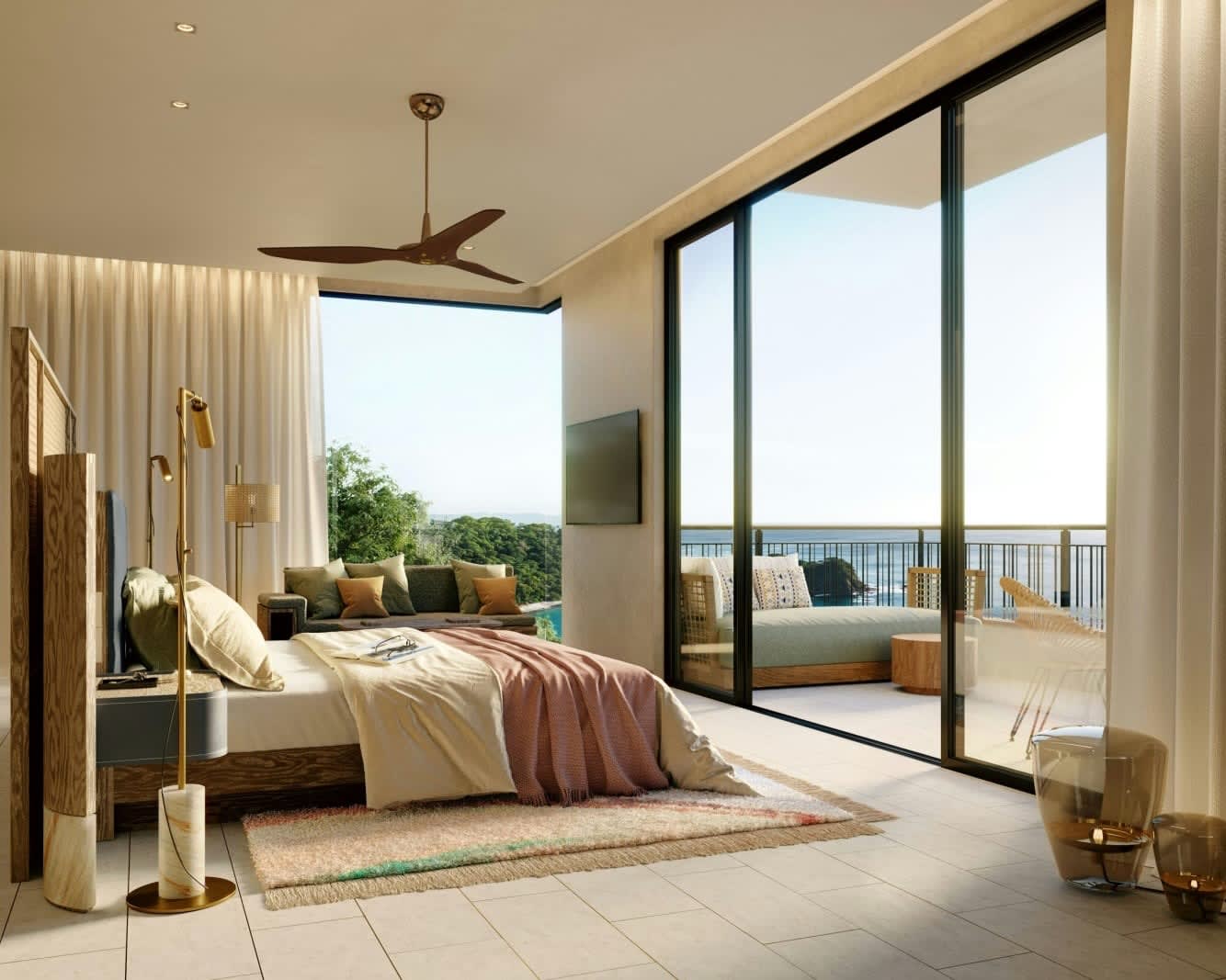 modern luxe hotel room with bed facing floor-to-ceiling sliding glass doors looking out at the ocean