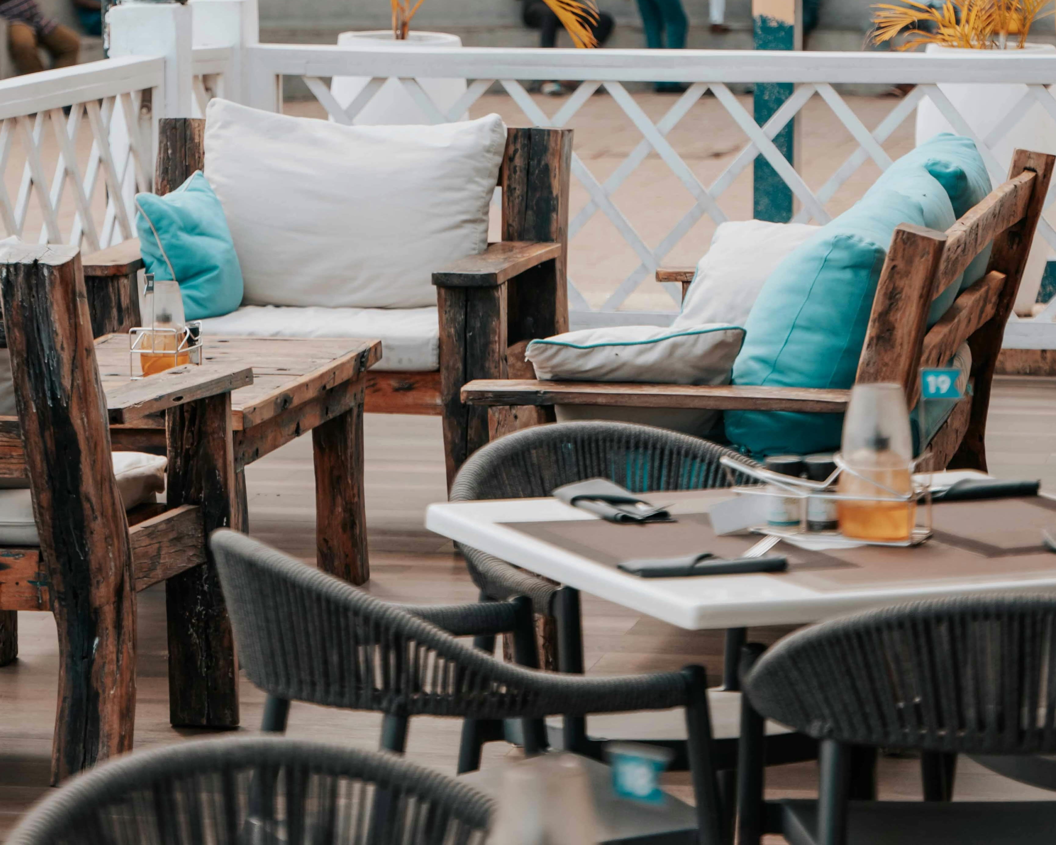 tables and chairs in a trendy outdoor restaurant setting