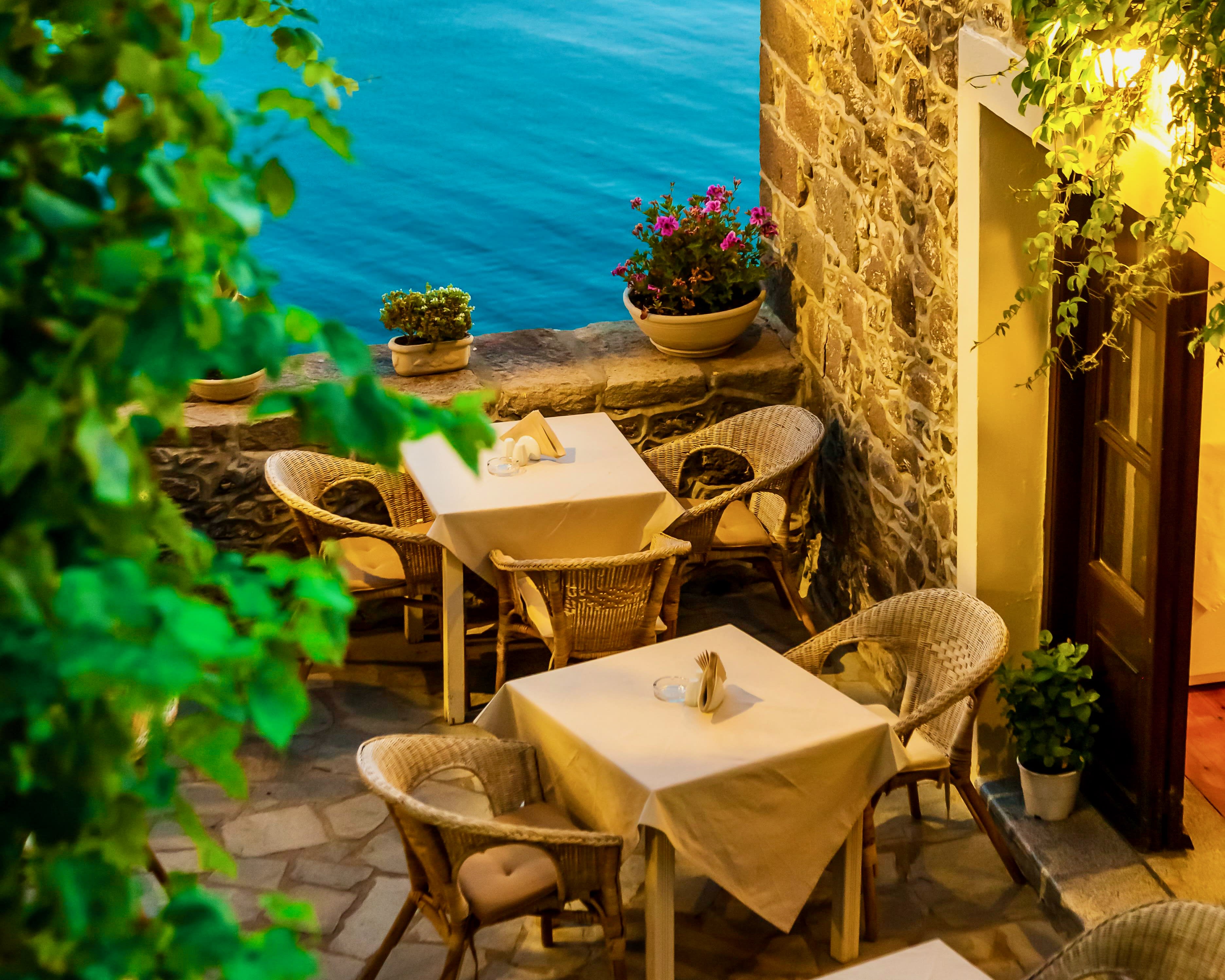 rustic dining next to a lake at dusk