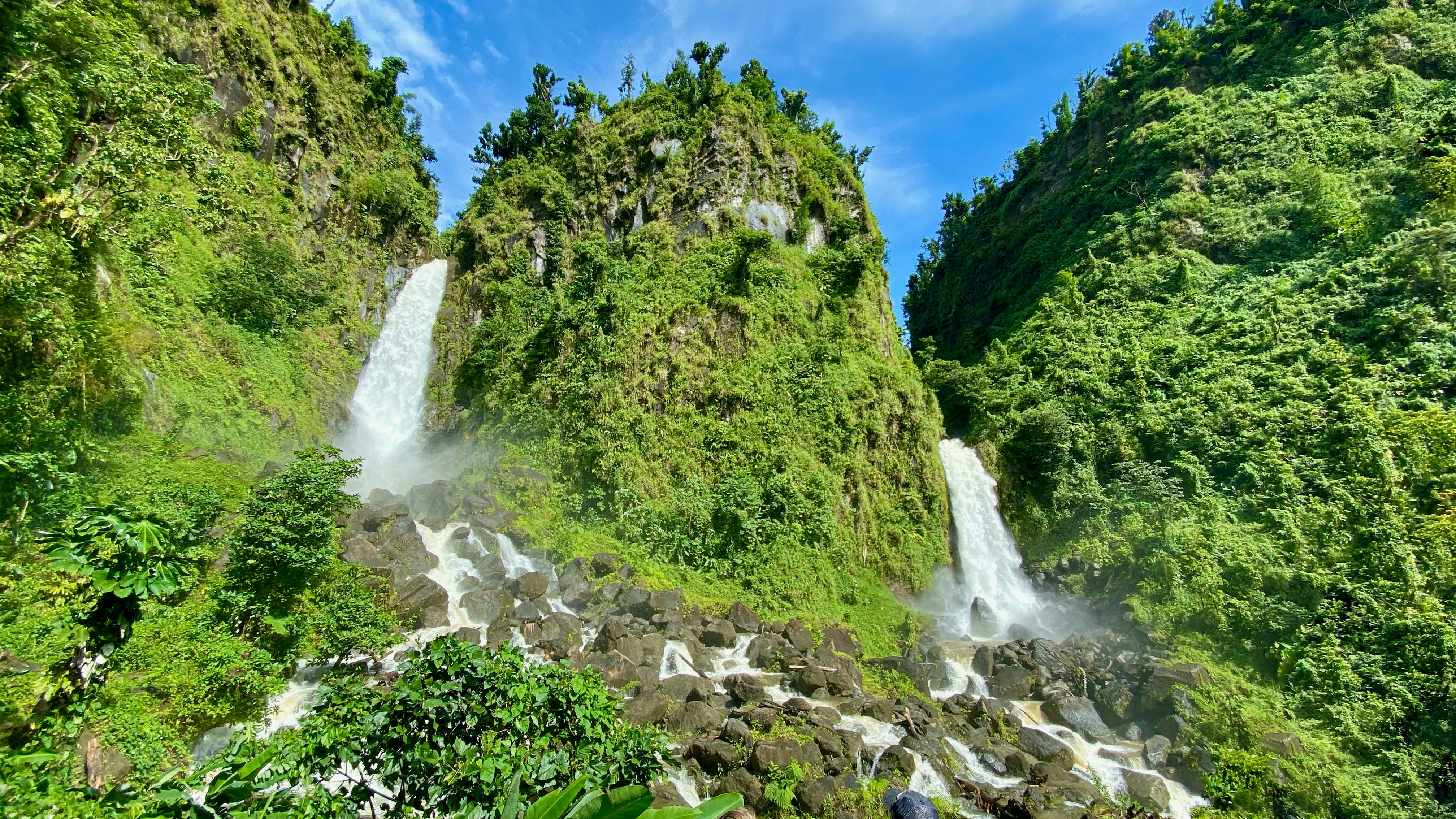 Green cliffs and waterfalls in Dominica