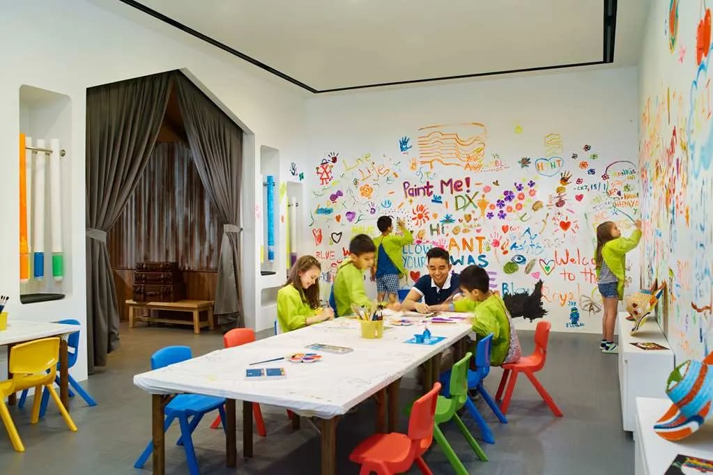 Kids work on a craft activity at the Shangri-La Singapore kids' club