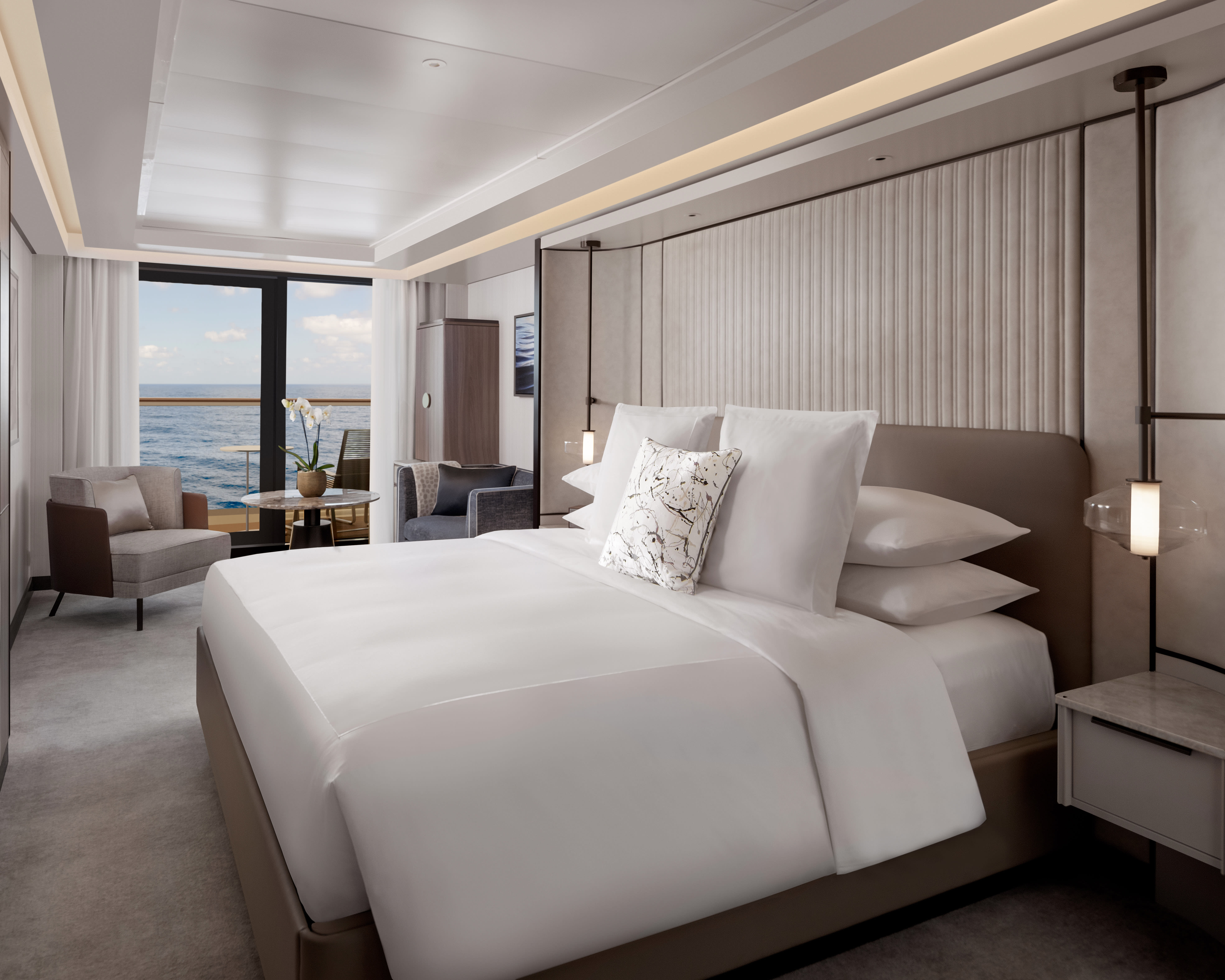 A modern luxury cruise cabin with taupe walls, white sheets, and tan chairs next to balcony doors