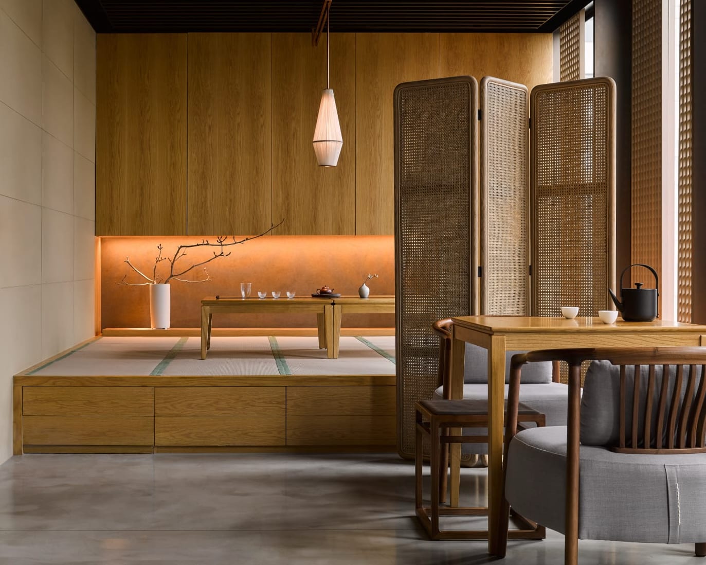 wood Japanese tea room with low tables and chairs, light wood, and zen styling