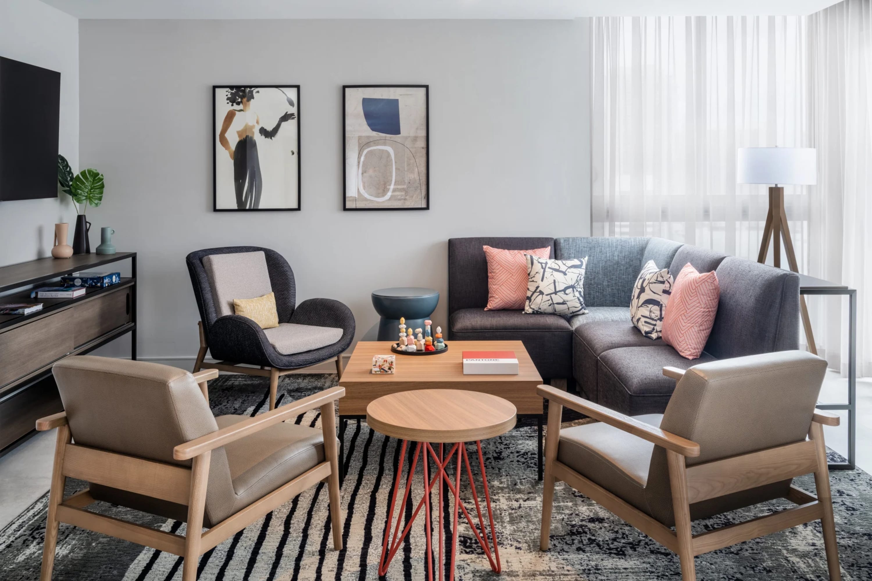 Large living room with trendy but simple decor and furnishings