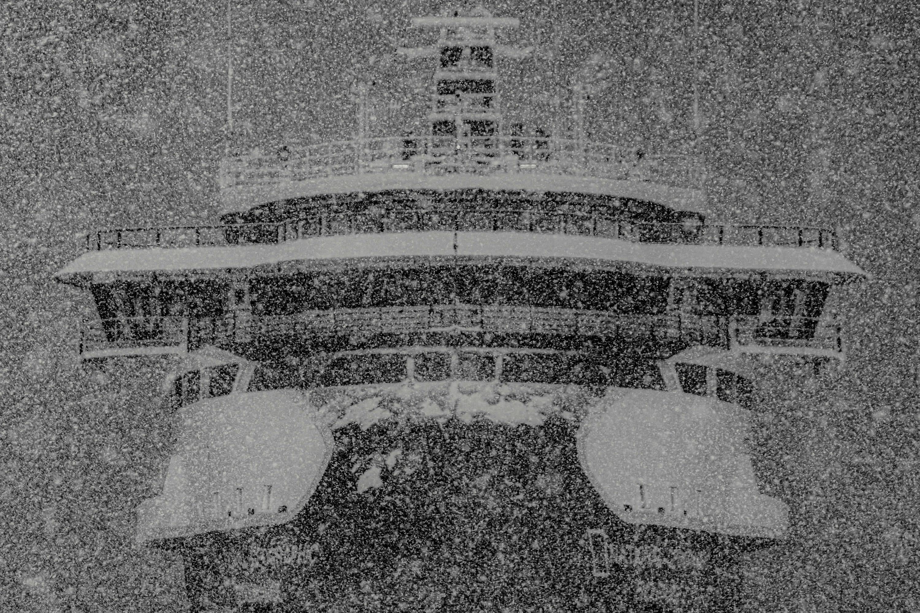 Blizzard conditions obscure an icebreaker cruise ship