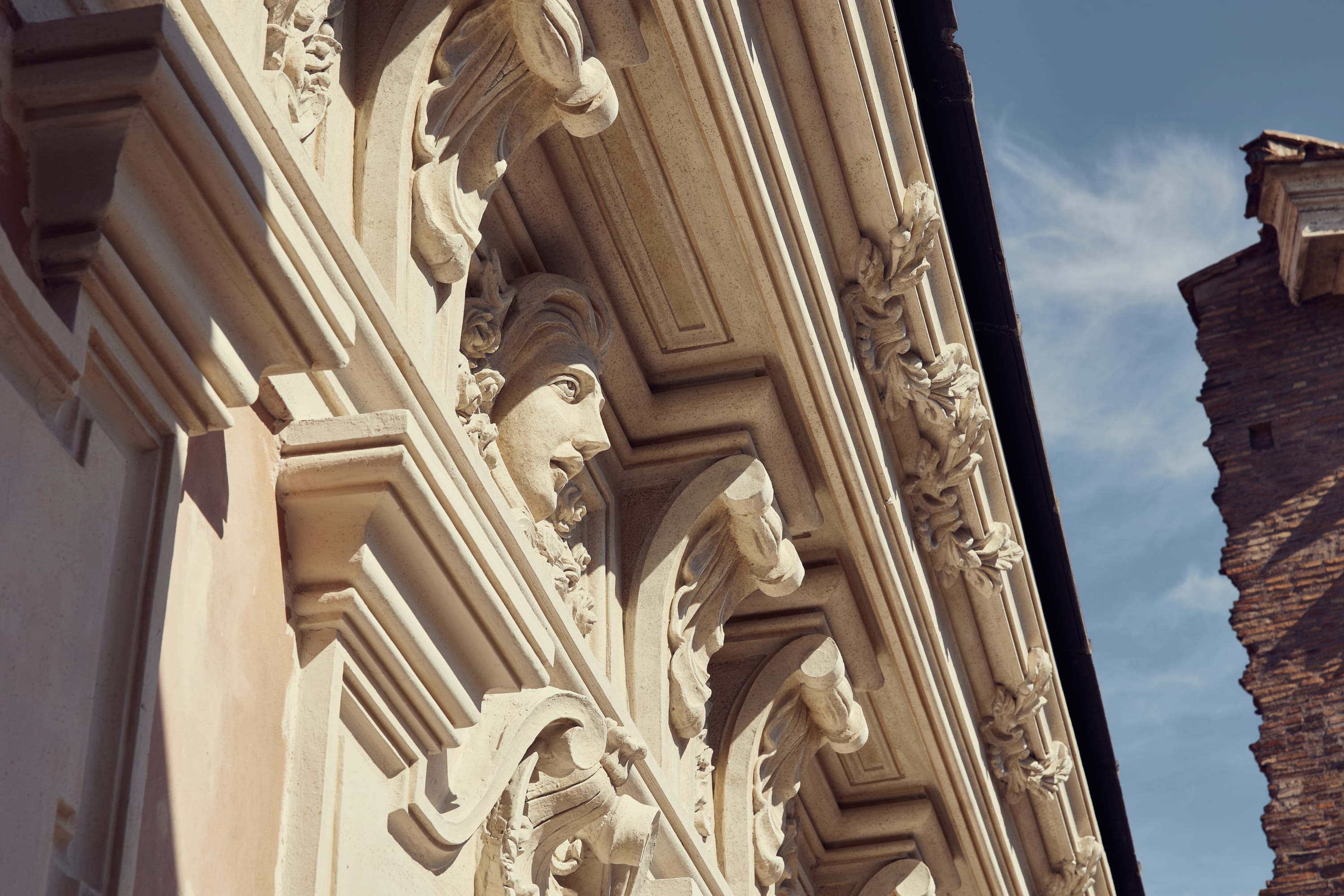 A closeup of the detail work in a neoclassical historical building in Rome