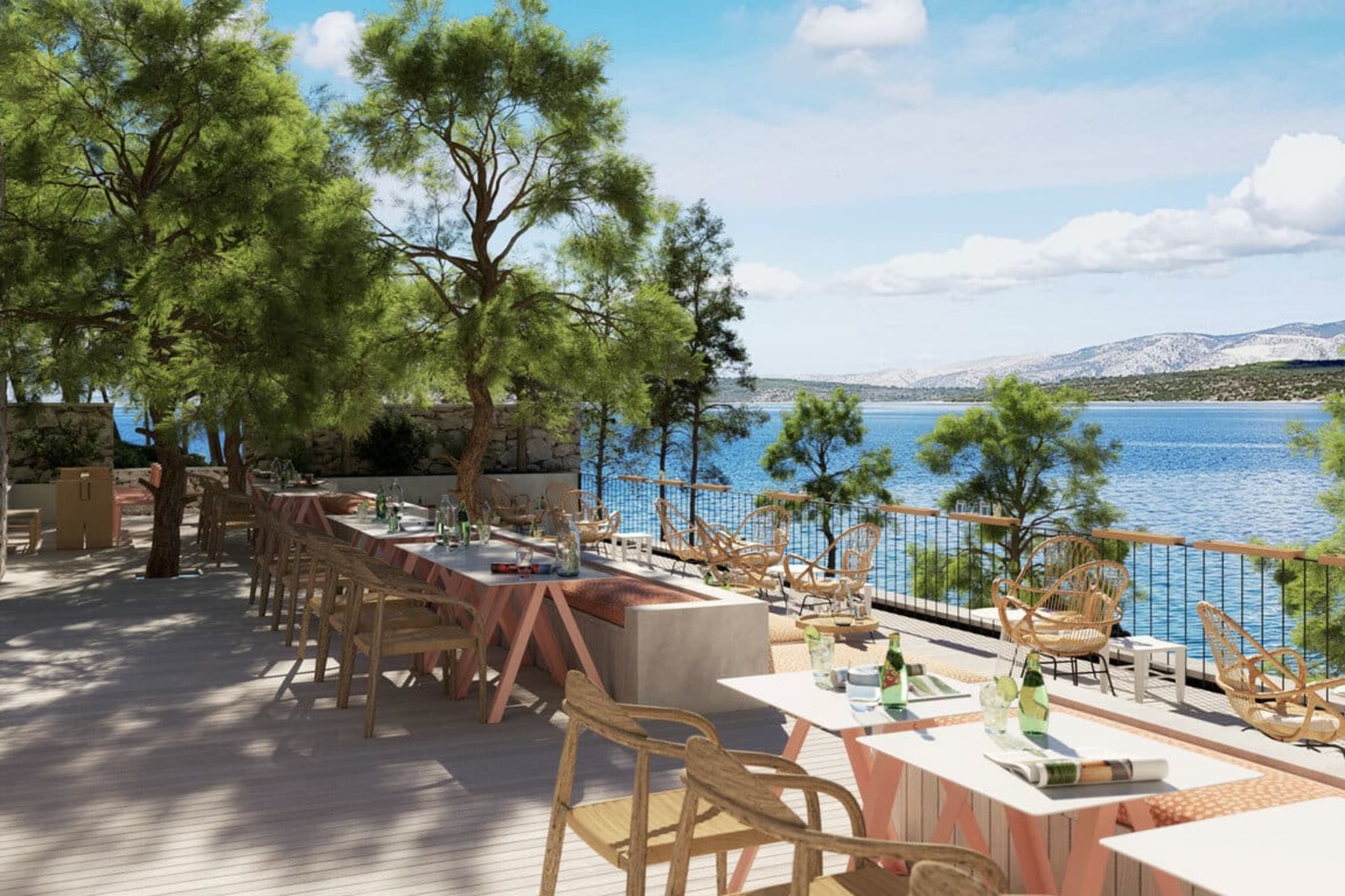 A few outdoor table settings on a hardwood platform overlooking the waters along Stari Grad