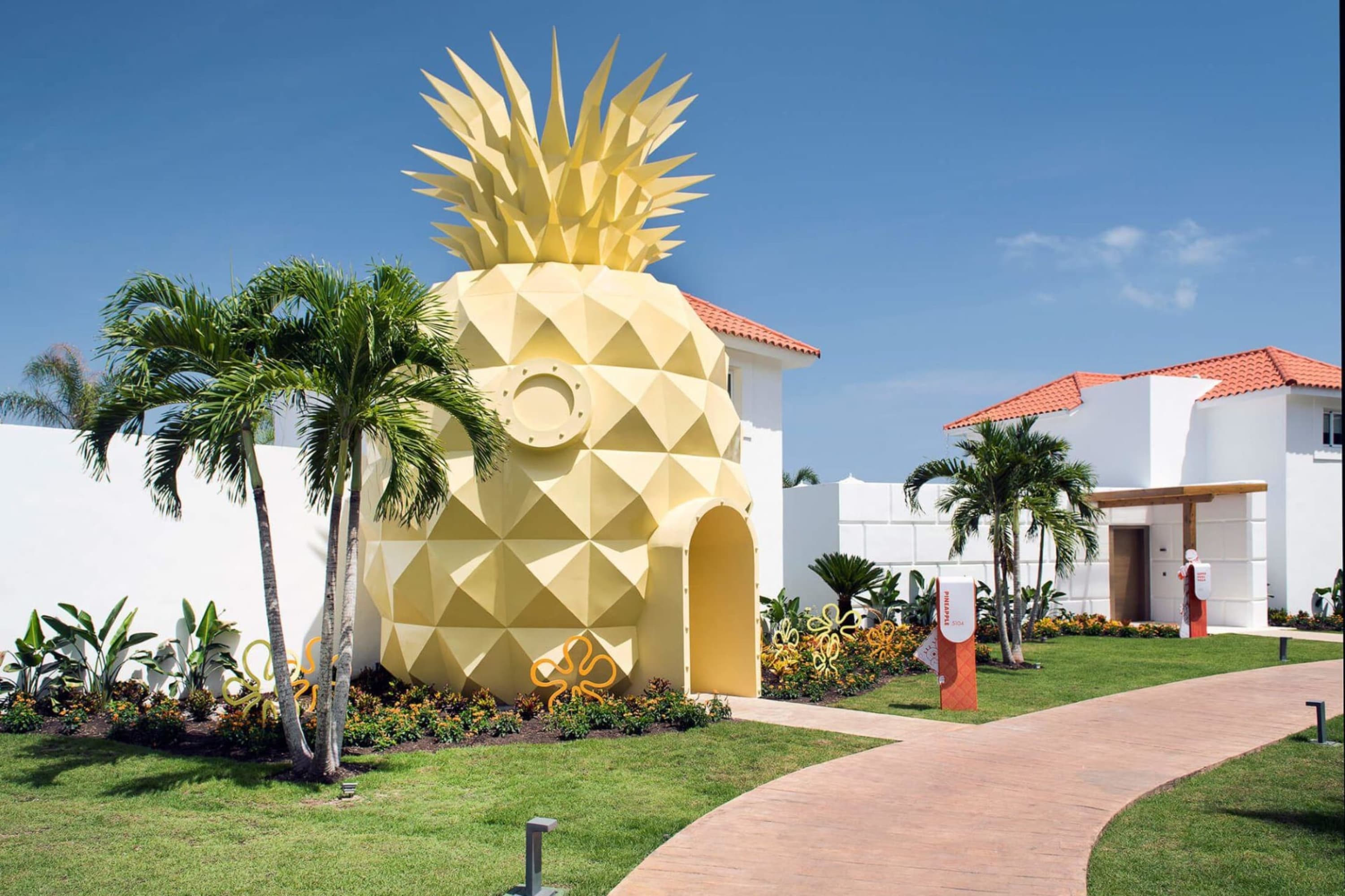 The entrance to a hotel building is shaped like Spongebob Squarepants' pineapple house
