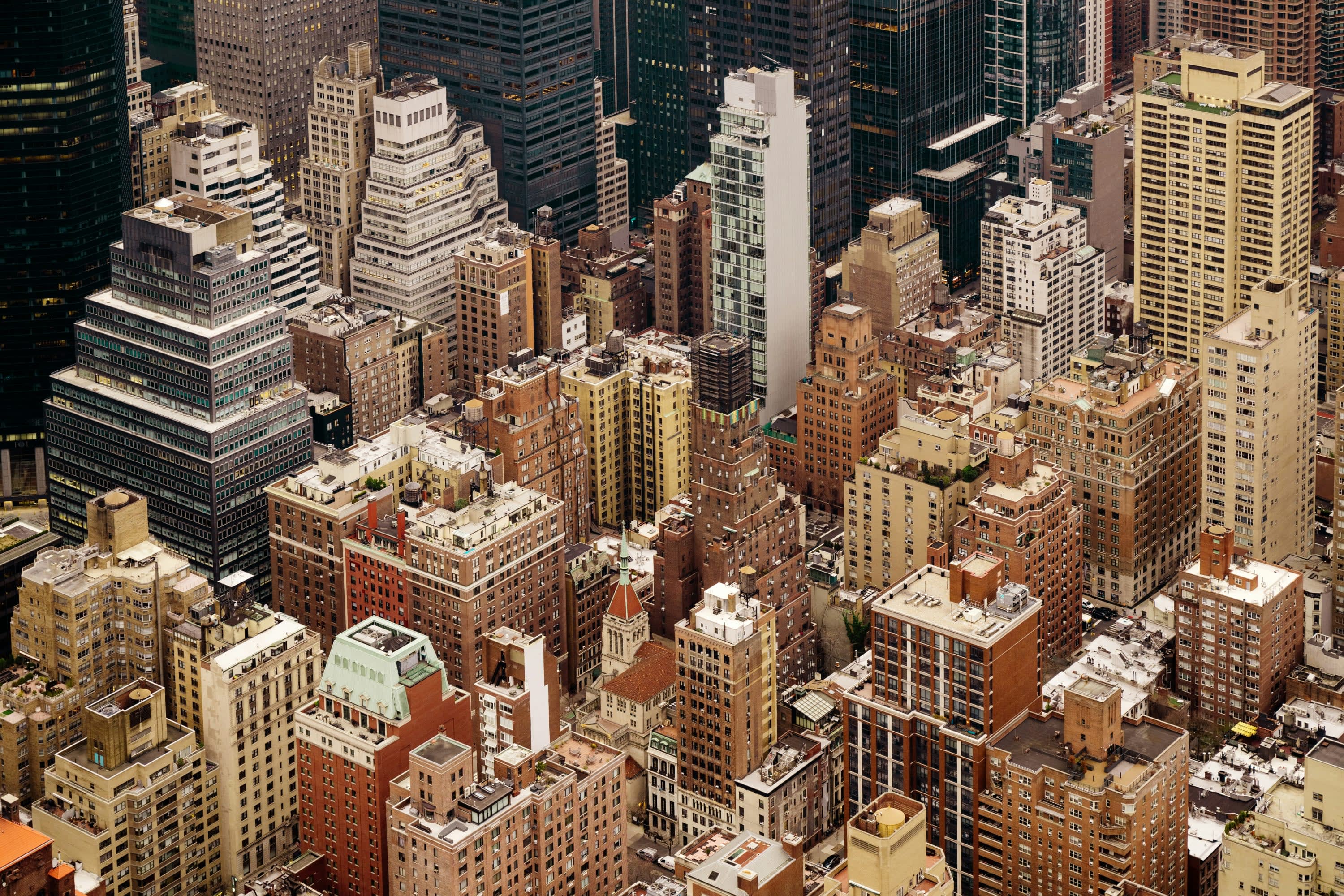 From above: dozens of skyscrapers, some with rooftop terraces and others with various equipment