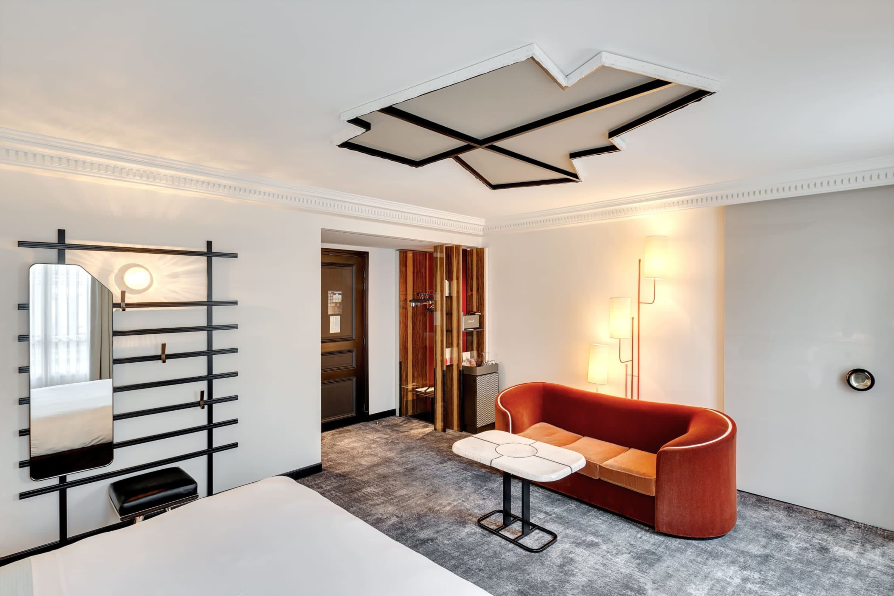 Posh hotel room with an avant-garde design focus and contemporary furnishings. The room is stylish and well lit