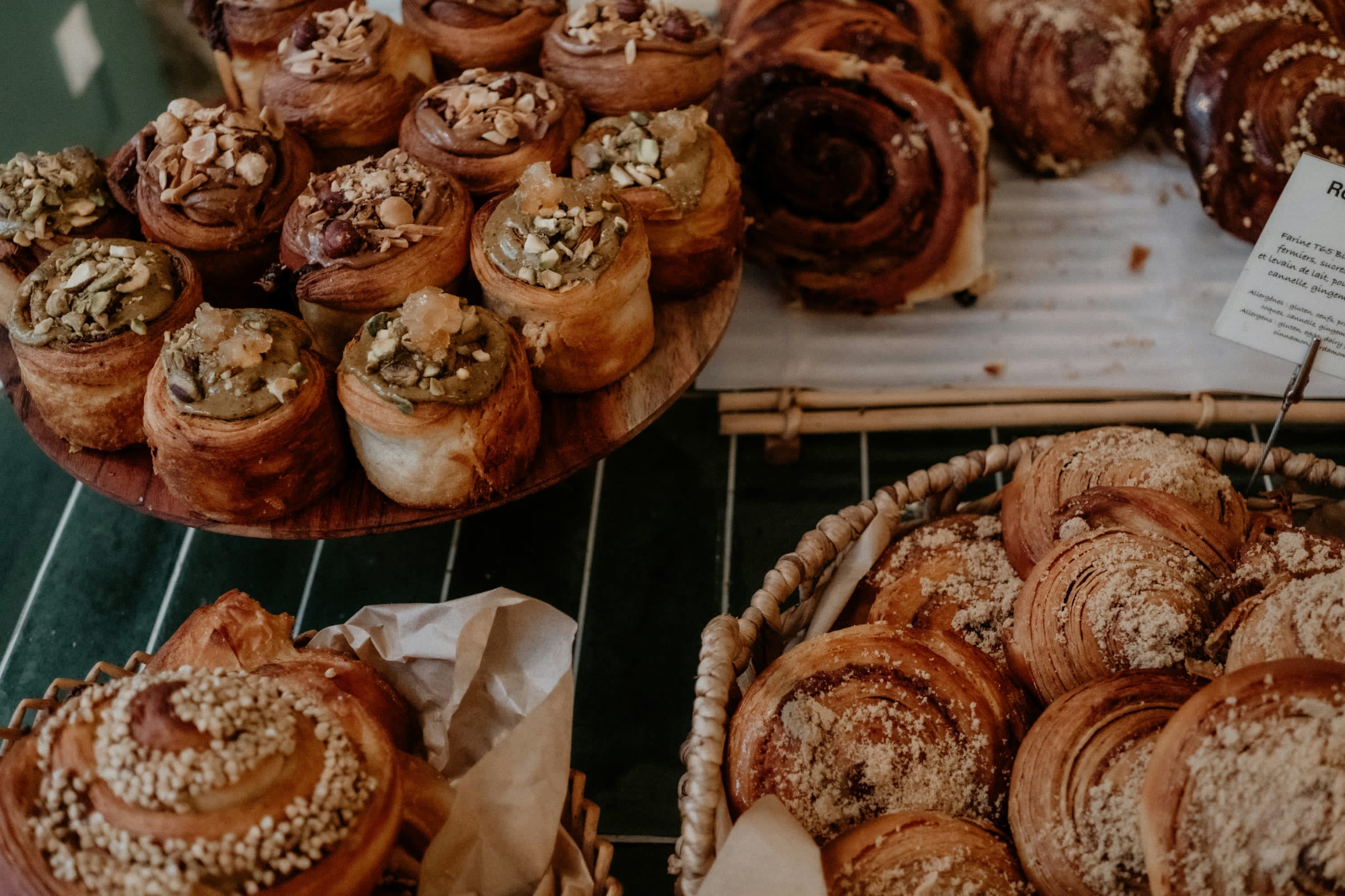 Professionally made French pastries on a display shelf, presumably for sale in a Parisian pastry shop