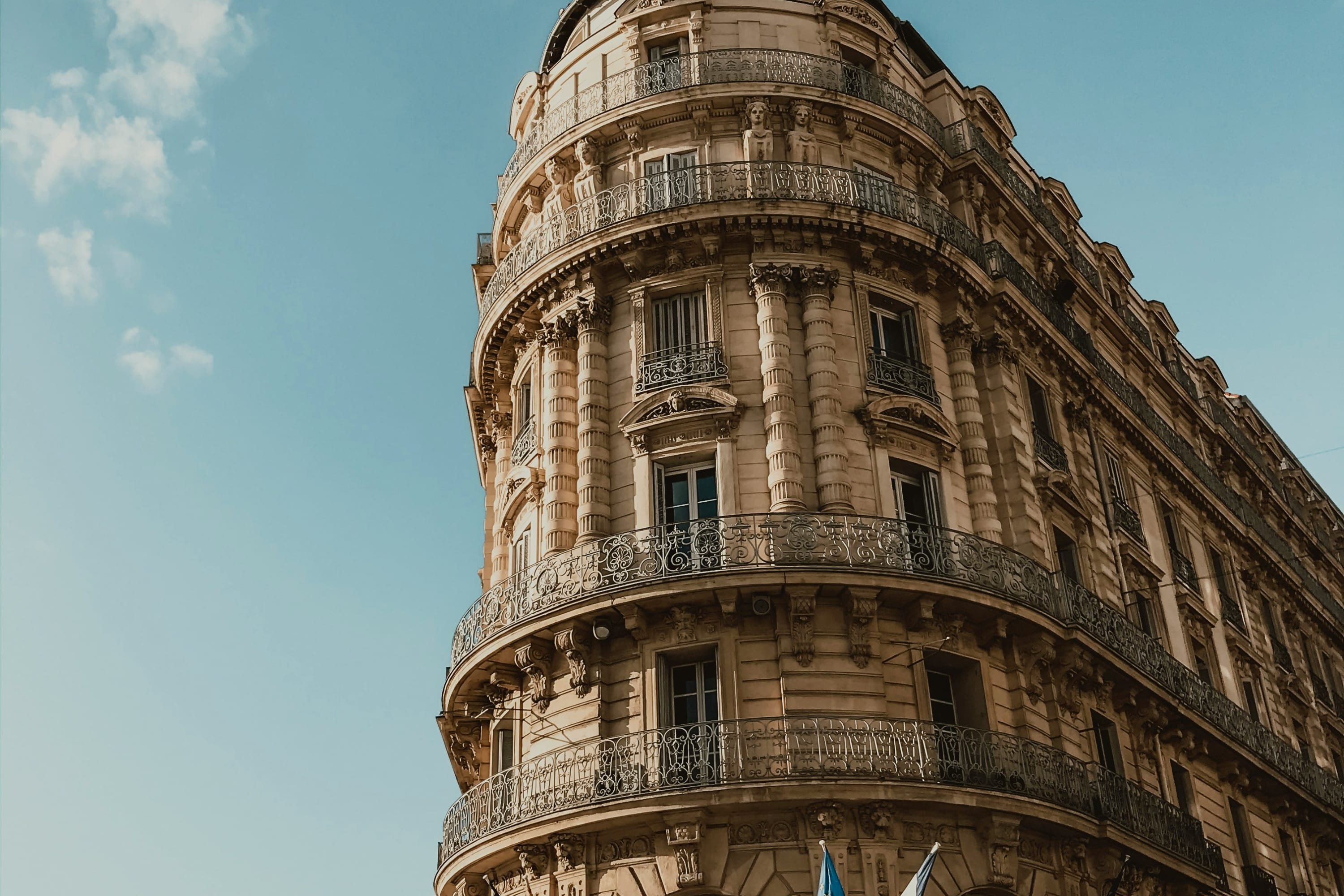 Ornate facade of a narrow historic building in Marseille