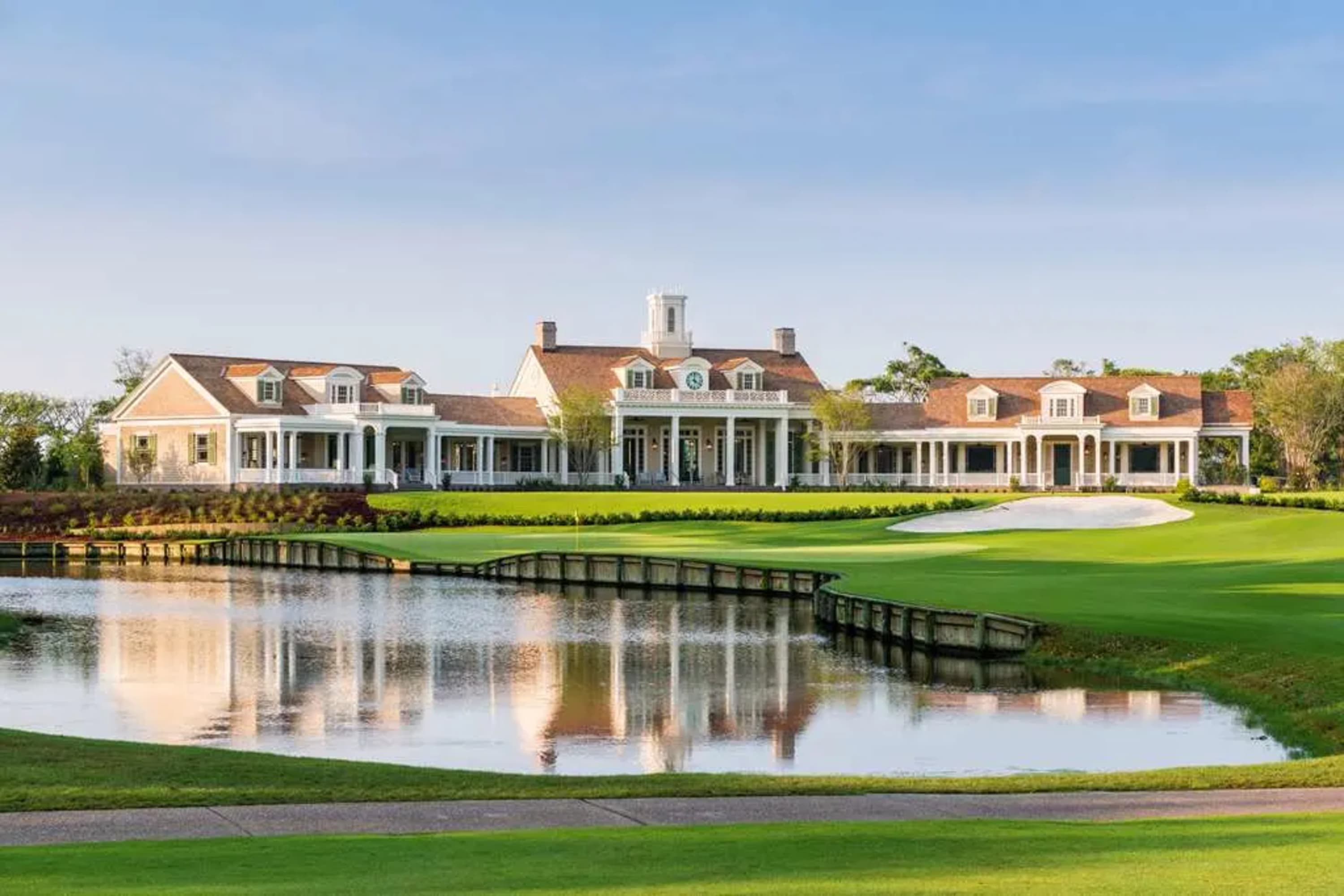 Golf green and ponds lead up to a Classical Southern coastal resort