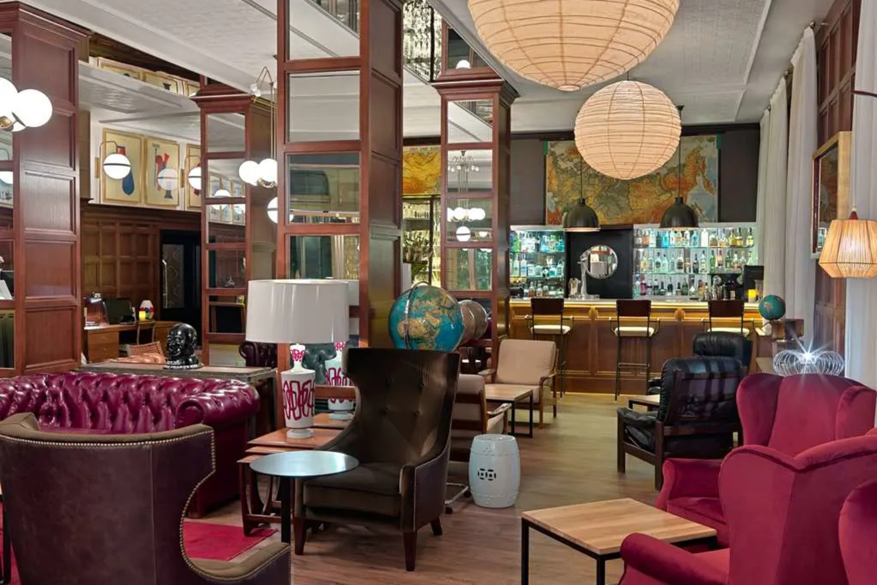 A sophisticated but modern lounge area with a mix of vintage and eclectic contemporary decor