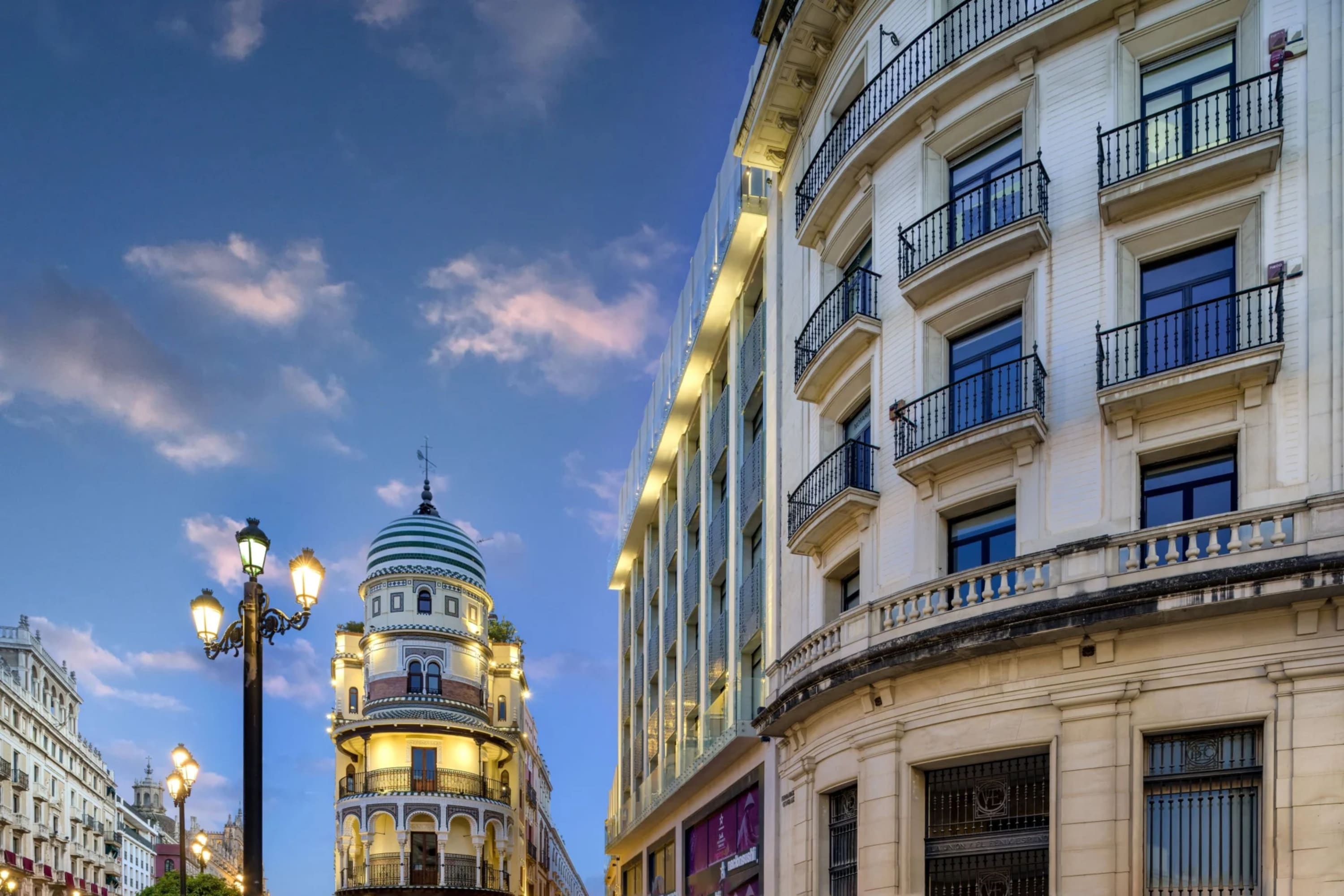 Historical facades and iron lamps at dusk