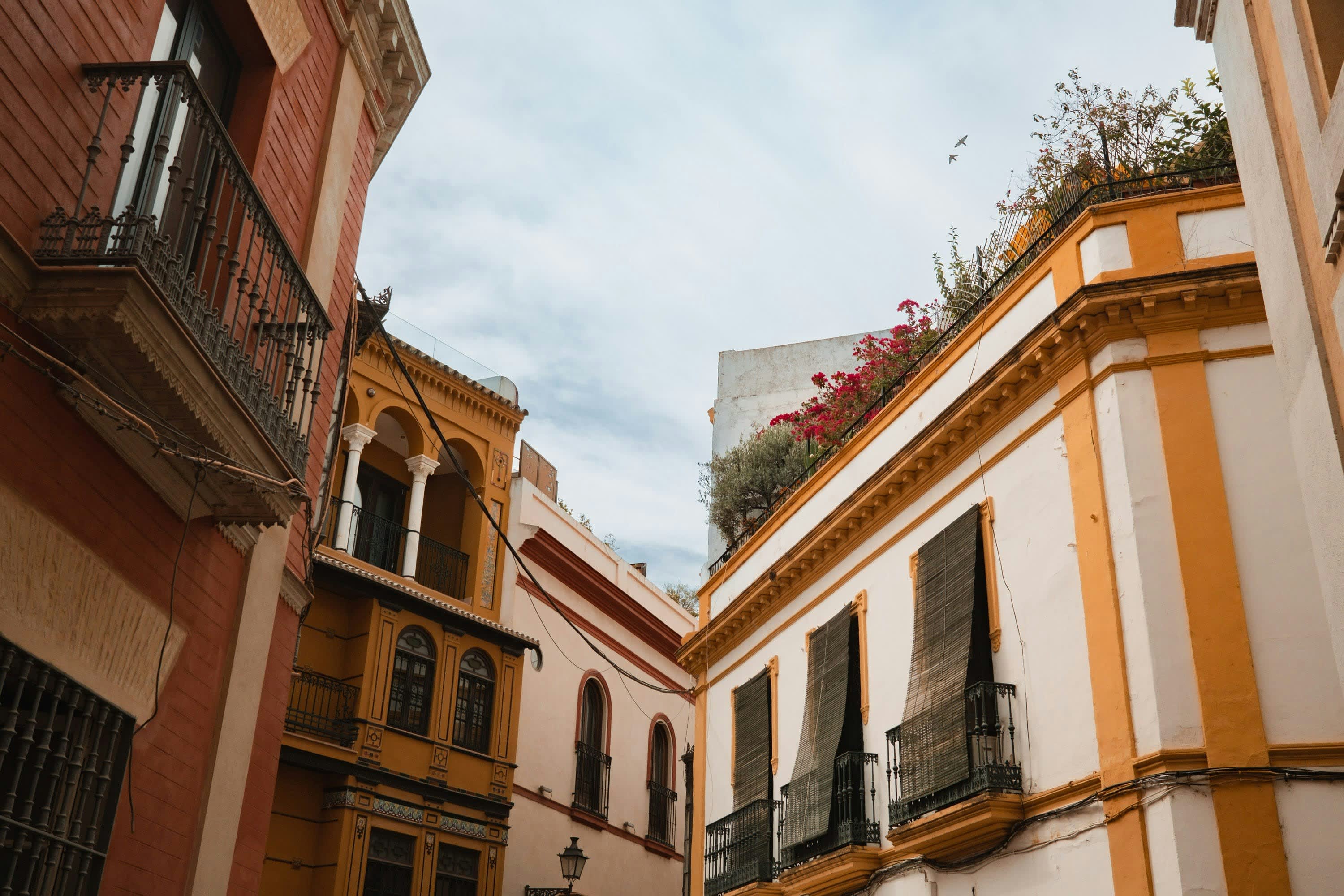 Historic residential architecture on a cloudy day in Seville