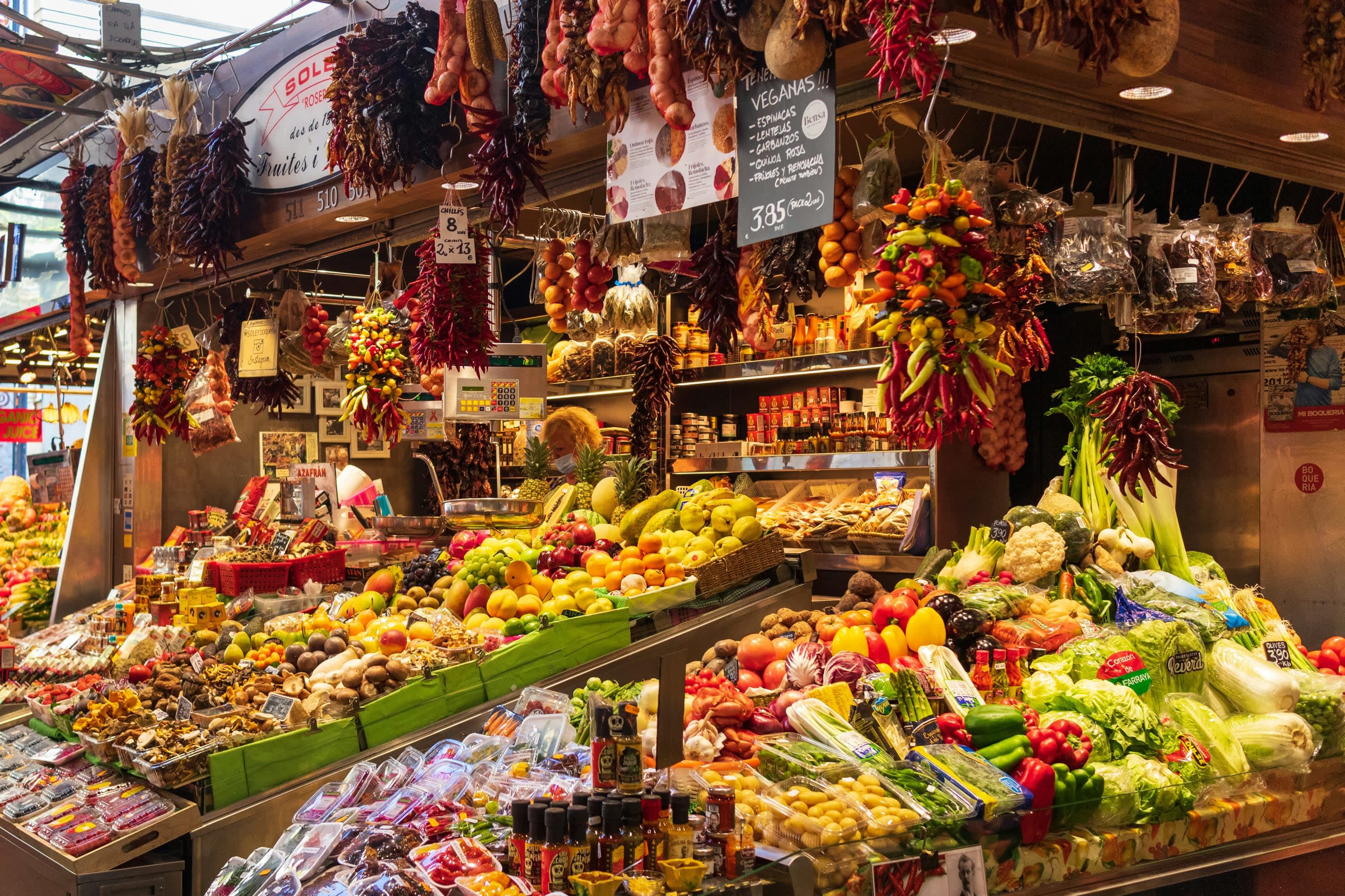 An assortment of produce on a stall in an open-air market